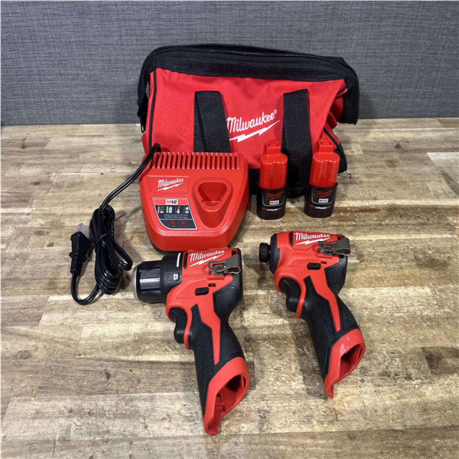 Houston Location AS-Is Milwaukee Drill Driver and Impact Driver and 2 Batteries with Charger