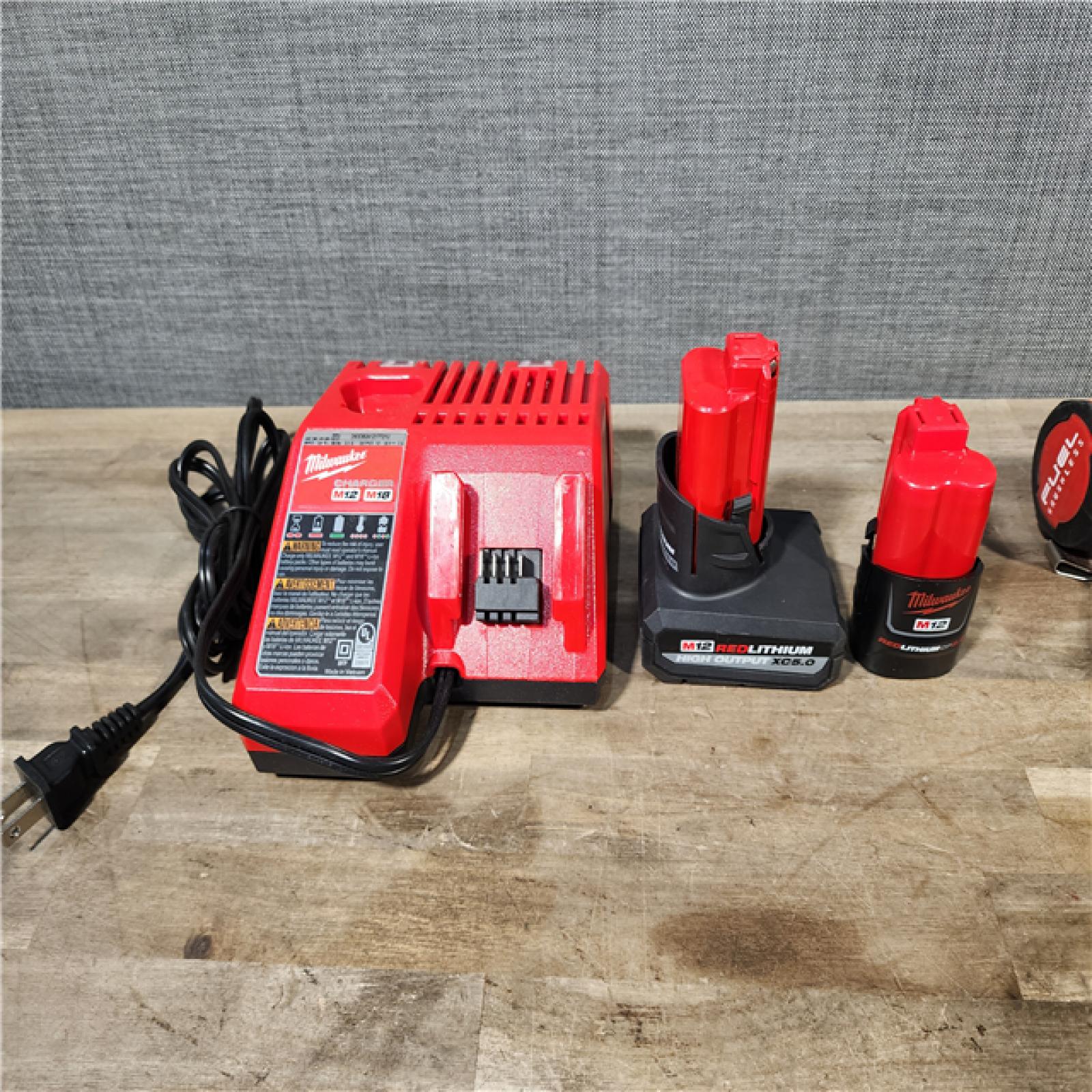 HOUSTON LOCATION - AS-IS MILWAUKEE 4 TOOL COMBO KIT W/ (2) BATTERY & CHARGER
