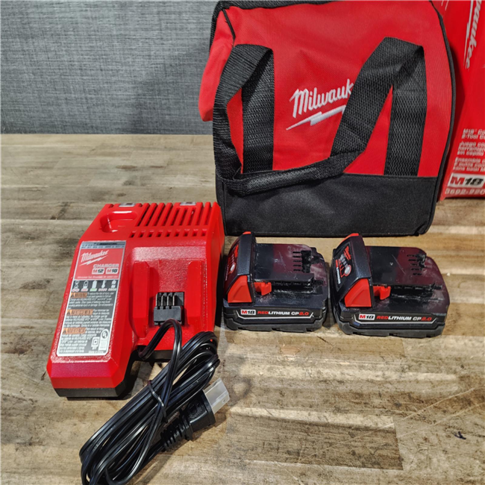 HOUSTON LOCATION - AS-IS Milwaukee M18 18V Lithium-Ion Brushless Cordless Compact Drill/Impact Combo Kit (2-Tool) W/(2) 2.0 Ah Batteries  Charger & Bag