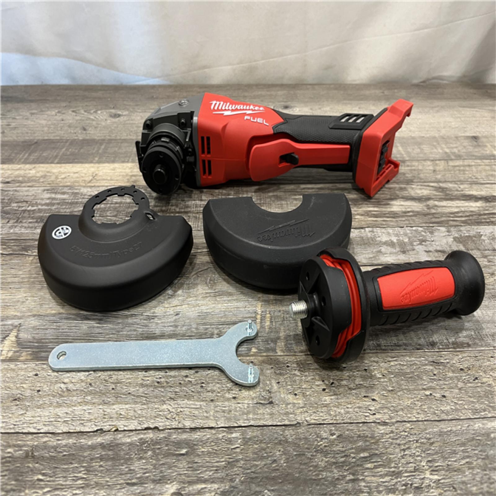 AS-IS Milwaukee FUEL 18V Lithium-Ion Brushless Cordless 4-1/2 in./5 in. Grinder w/Paddle Switch (Tool-Only)