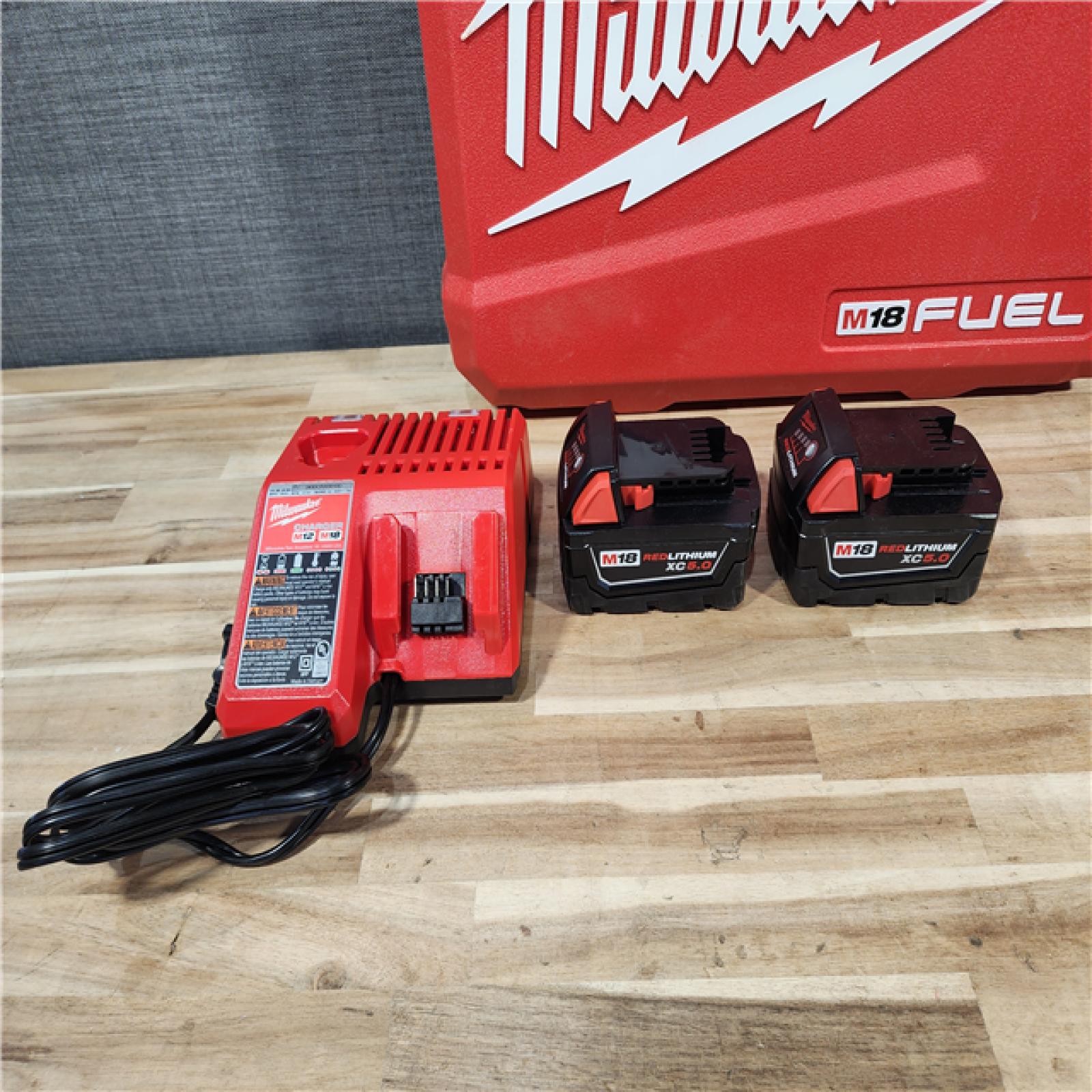 HOUSTON LOCATION - AS-IS (APPEARS LIKE NEW) Milwaukee  FUEL 18V Lithium-Ion Brushless Cordless Hammer Drill and Impact Driver Combo Kit