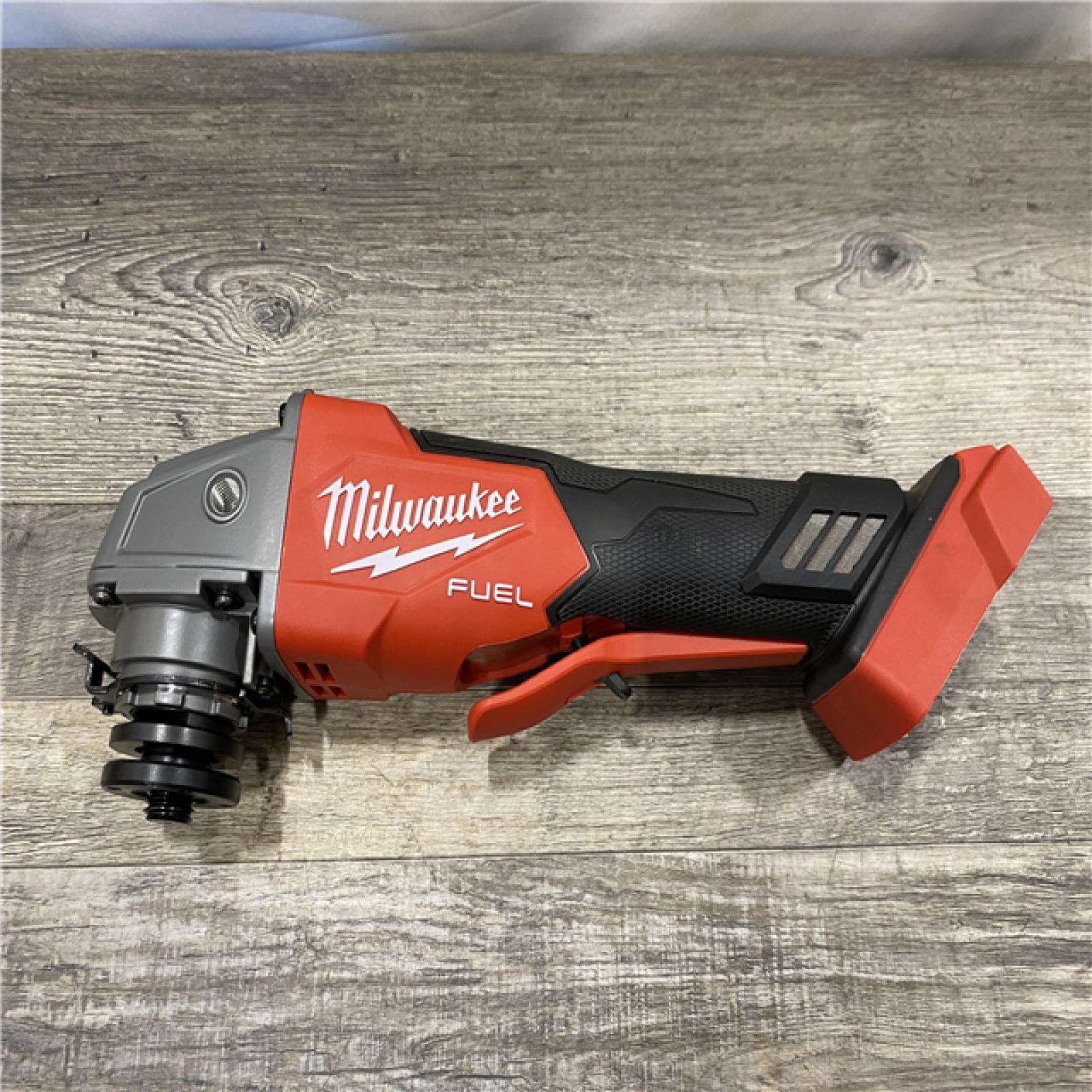 AS-IS Milwaukee FUEL 18V Lithium-Ion Brushless Cordless 4-1/2 in./5 in. Grinder w/Paddle Switch (Tool-Only)