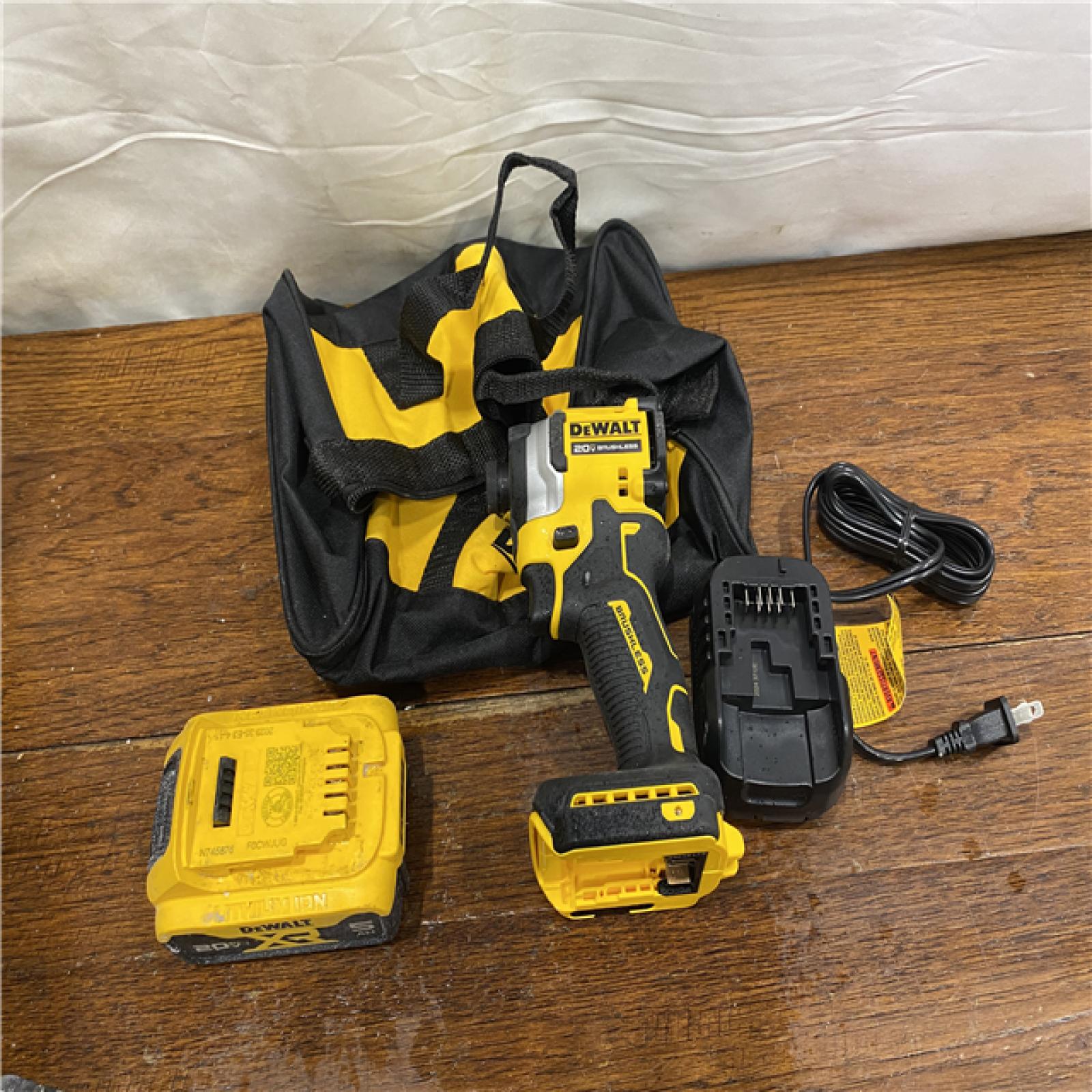AS-IS DEWALT ATOMIC 20V MAX Lithium-Ion Cordless 1/4 in. Brushless Impact Driver Kit, 5 Ah Battery, Charger, and Bag
