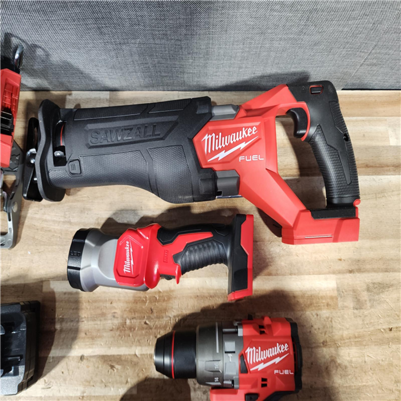 HOUSTON LOCATION - AS - IS M18 FUEL 18V Lithium-Ion Brushless Cordless 5-Tool Combo Kit with Two 5.0 Ah Batteries  1 Charger 1 Tool Bag