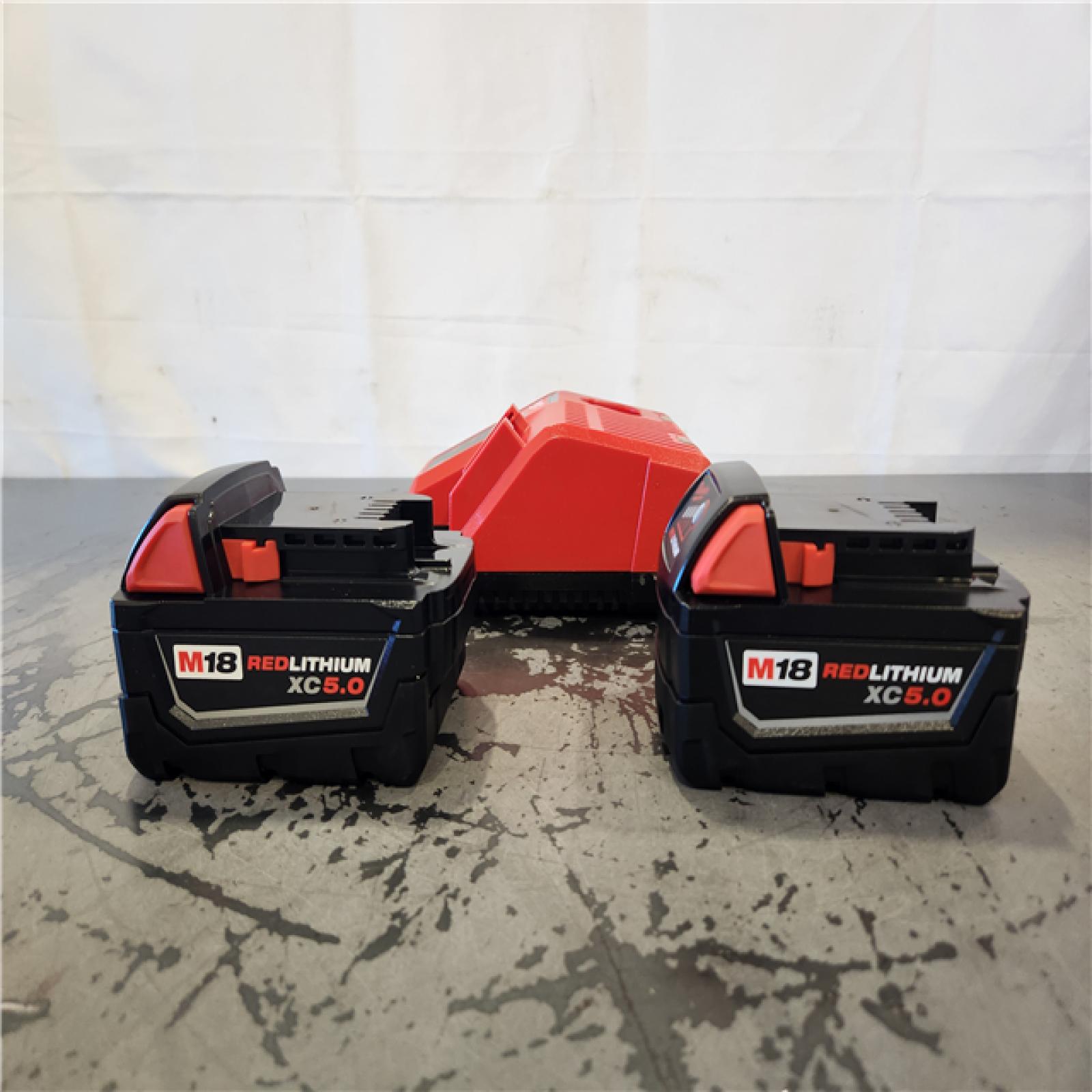 AS-IS- Milwaukee 18-Volt Lithium-Ion XC Starter Kit with Two 5.0Ah Batteries and Charger