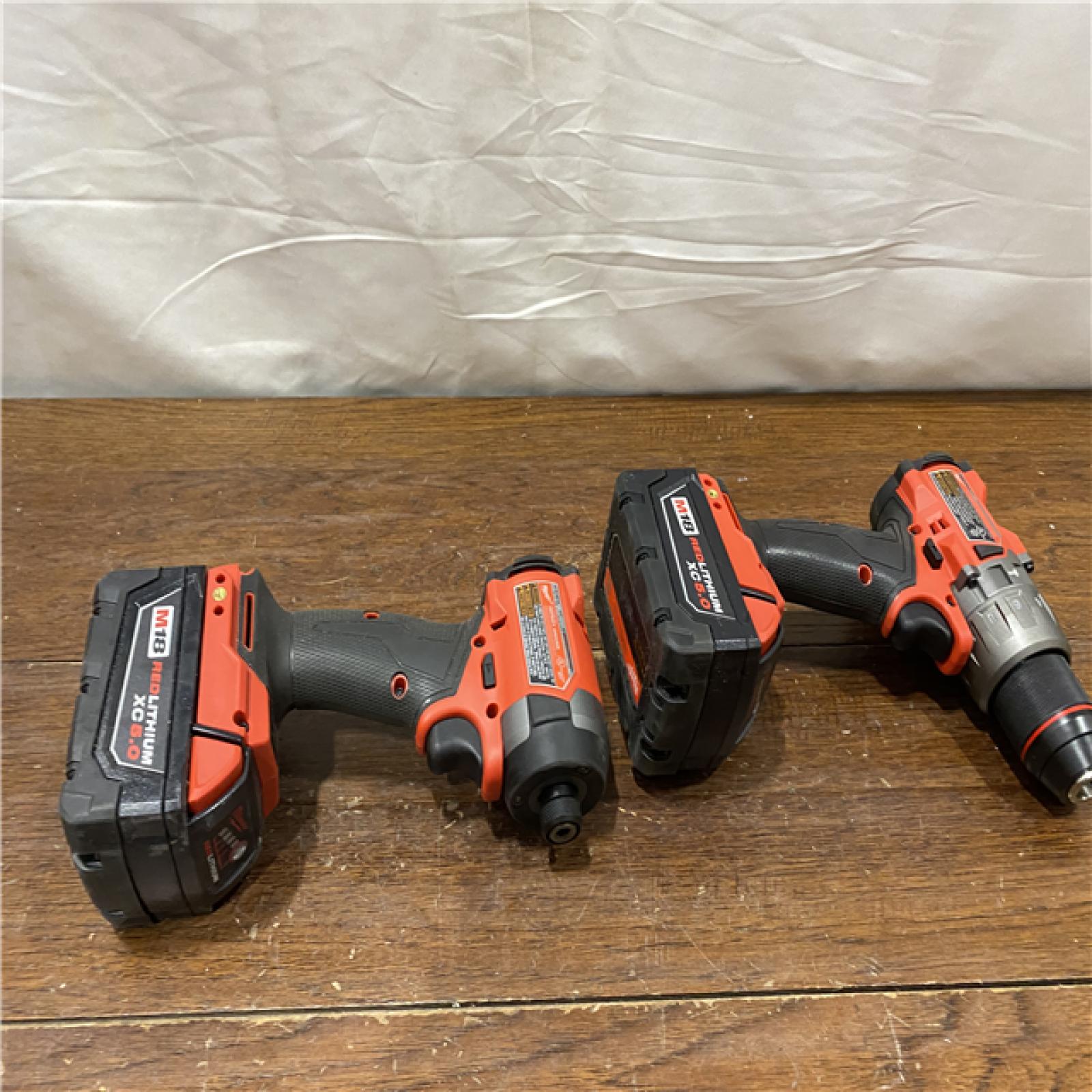 AS-IS MILWAUKEE M18 FUEL 18V Lithium-Ion Brushless Cordless Hammer Drill and Impact Driver Combo Kit (2-Tool) with 2 Batteries