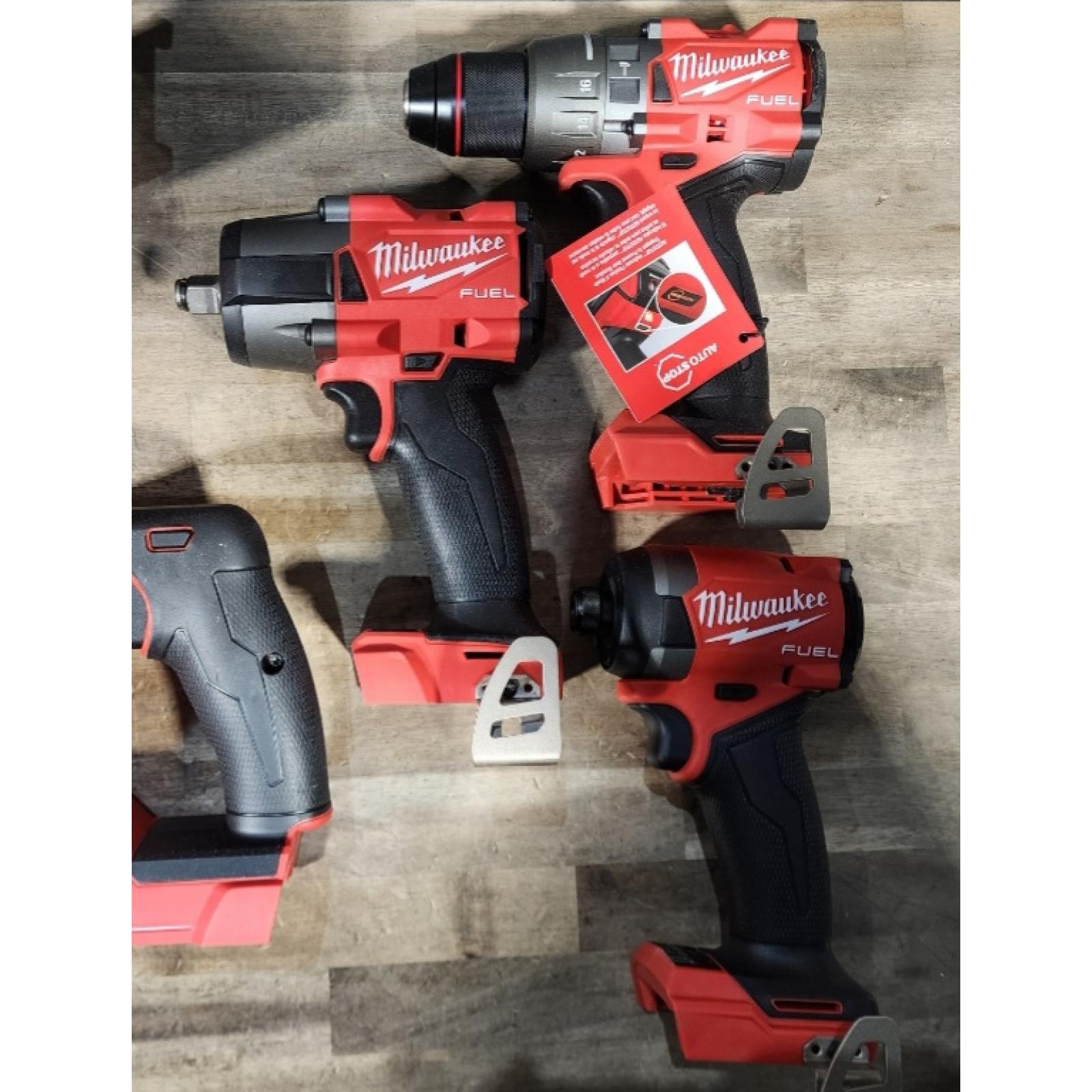HOUSTON LOCATION - AS-IS (APPEARS LIKE NEW) Milwaukee M18 FUEL 18V Lithium-Ion Brushless Cordless Combo Kit with Two 5.0 Ah Batteries  1 Charger  2 Tool Bags (7-Tool)