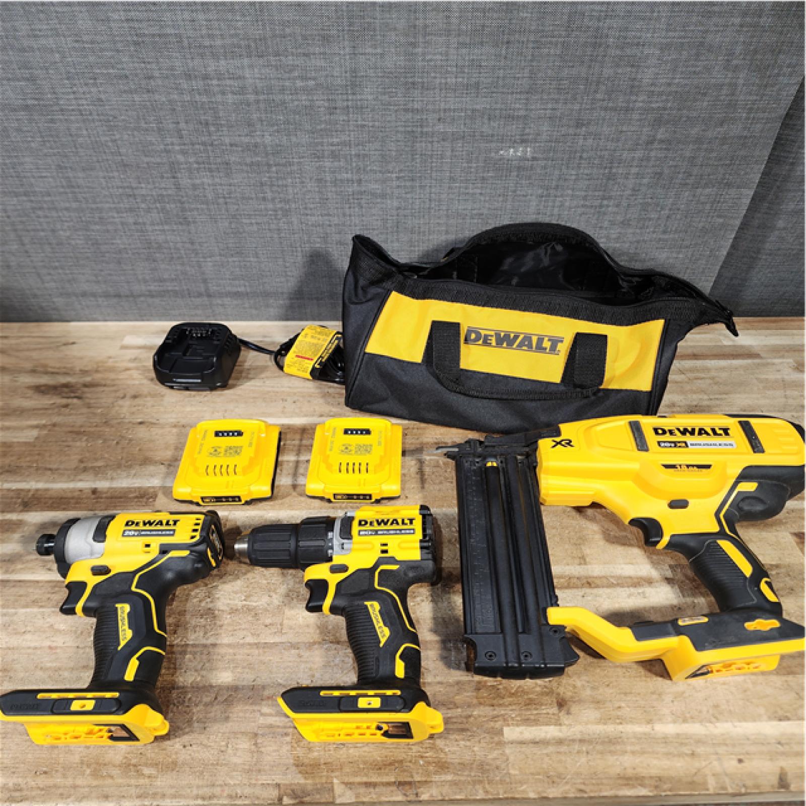 Houston Location AS-IS DEWALT Drill and Impact Nail Gun and Batteries QTY/ 2 with Charger