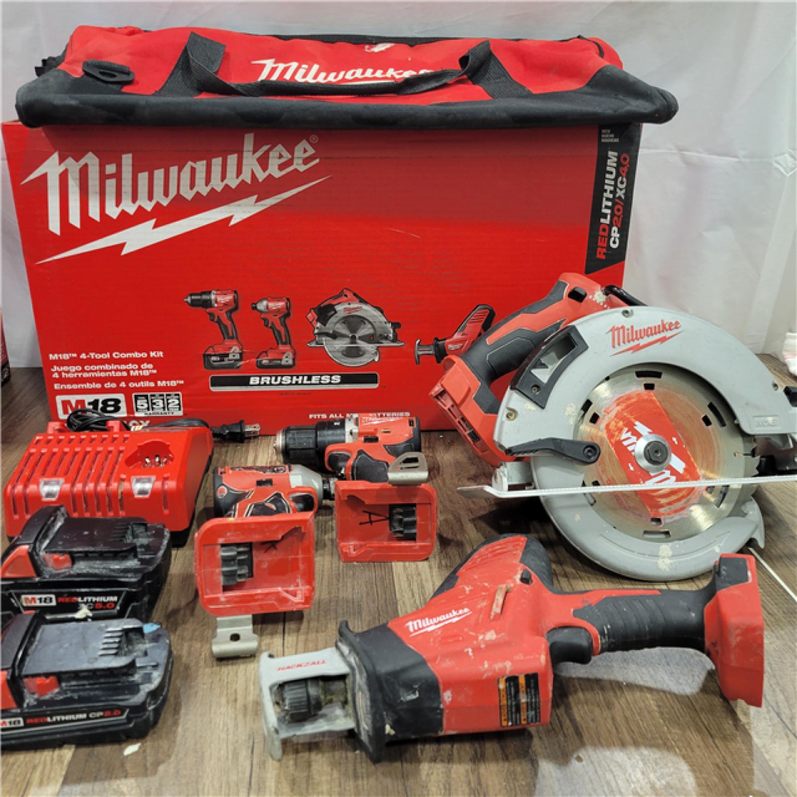 AS-IS Milwaukee M18 18-Volt Lithium-Ion Brushless Cordless Combo Kit (4-Tool) with 2-Batteries, 1-Charger and Tool Bag