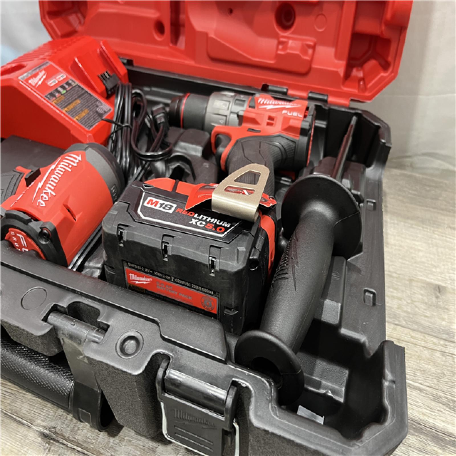 AS-IS Milwaukee FUEL 18V Lithium-Ion Brushless Cordless Hammer Drill and Impact Driver Combo Kit