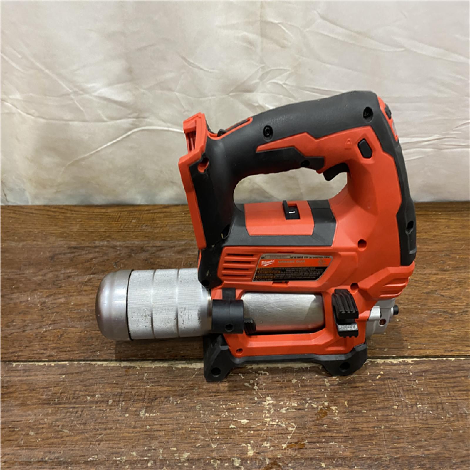 AS-IS Milwaukee Tool 10,000 PSI 14 Oz Battery-Operated Grease Gun - 48 Flexible Hose, 31 Strokes/oz | Part #2646-20