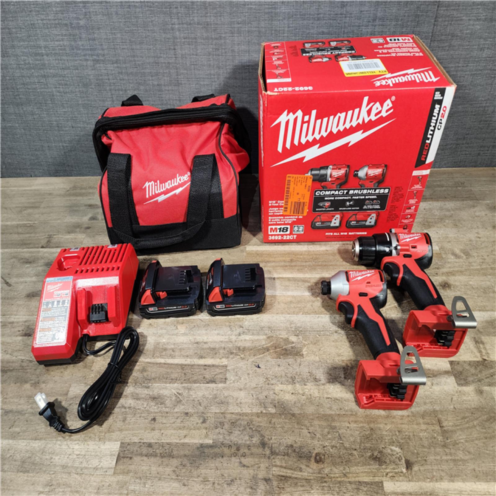 HOUSTON LOCATION - AS-IS Milwaukee M18 18V Lithium-Ion Brushless Cordless Compact Drill/Impact Combo Kit (2-Tool) W/(2) 2.0 Ah Batteries  Charger & Bag
