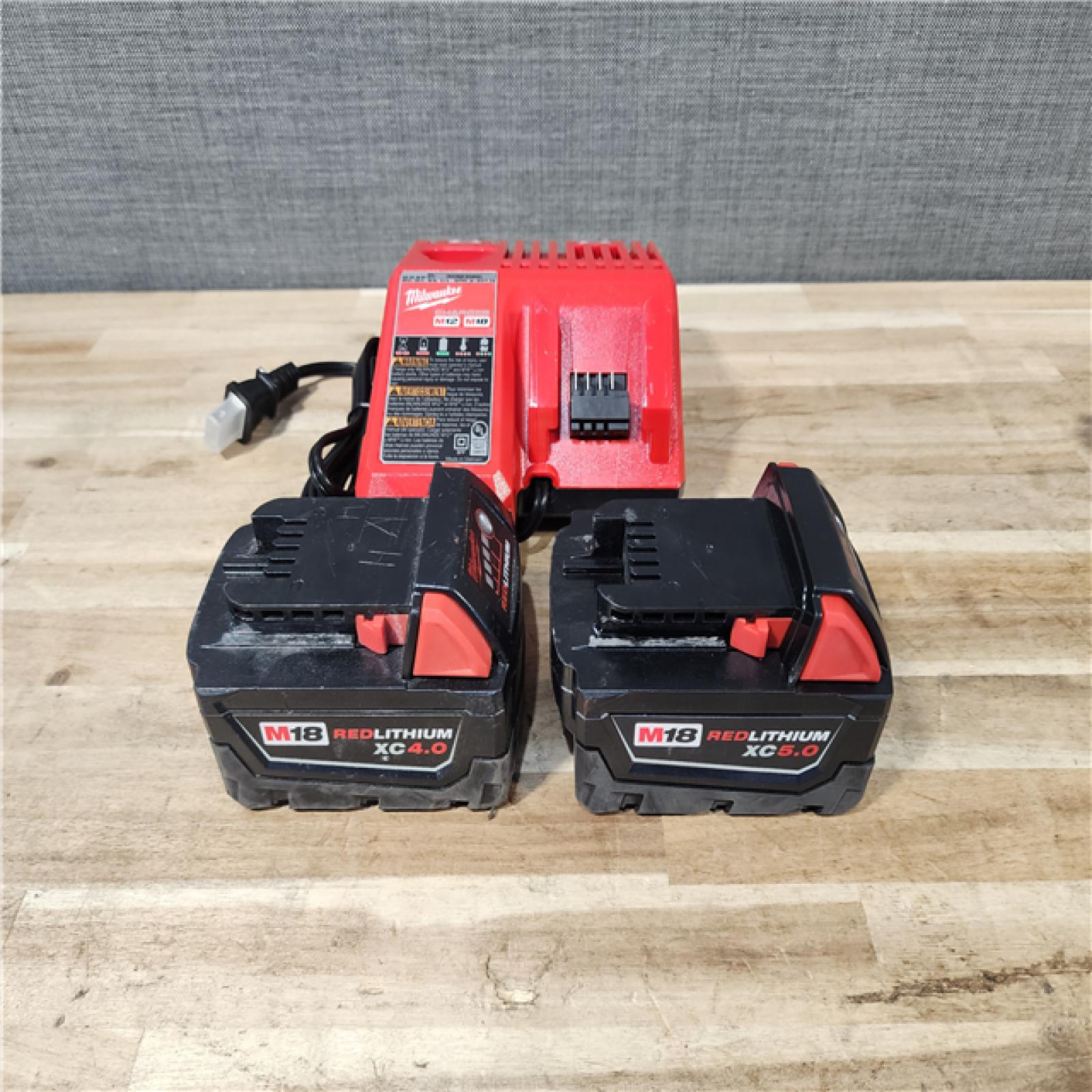 HOUSTON LOCATION - AS-IS MILWAUKEE 2 TOOL COMBO KIT W/ (2) BATTERY & CHARGER