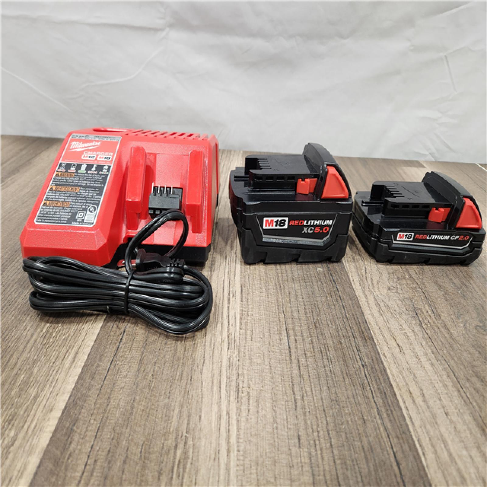 AS-IS - Milwaukee M18 18-Volt Lithium-Ion Starter Kit with One 5.0 Ah and One 2.0 Ah Battery and Charger