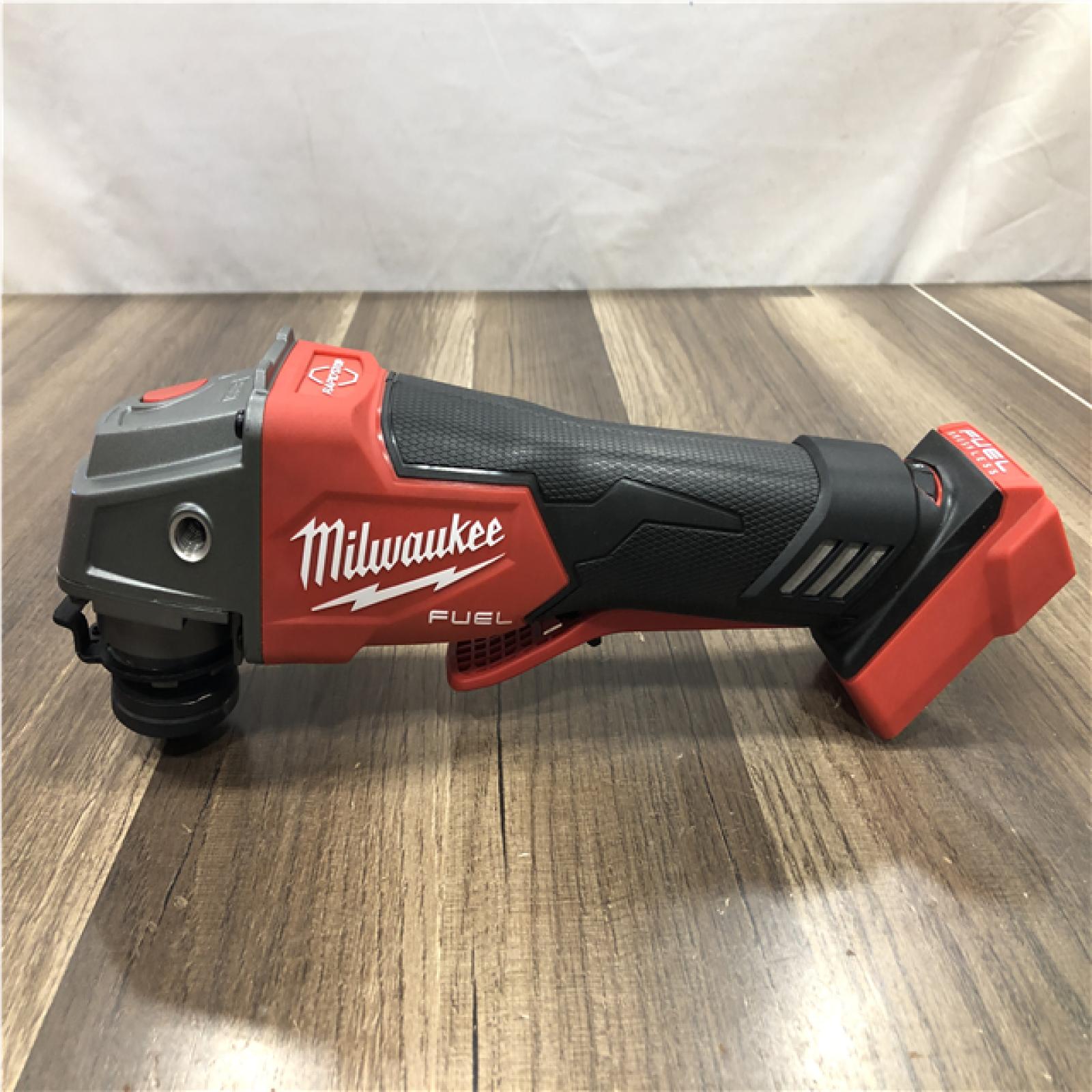 AS-IS Milwaukee FUEL 18V Lithium-Ion Brushless Cordless 4-1/2 in./5 in. Grinder with Variable Speed & Paddle Switch (Tool-Only)