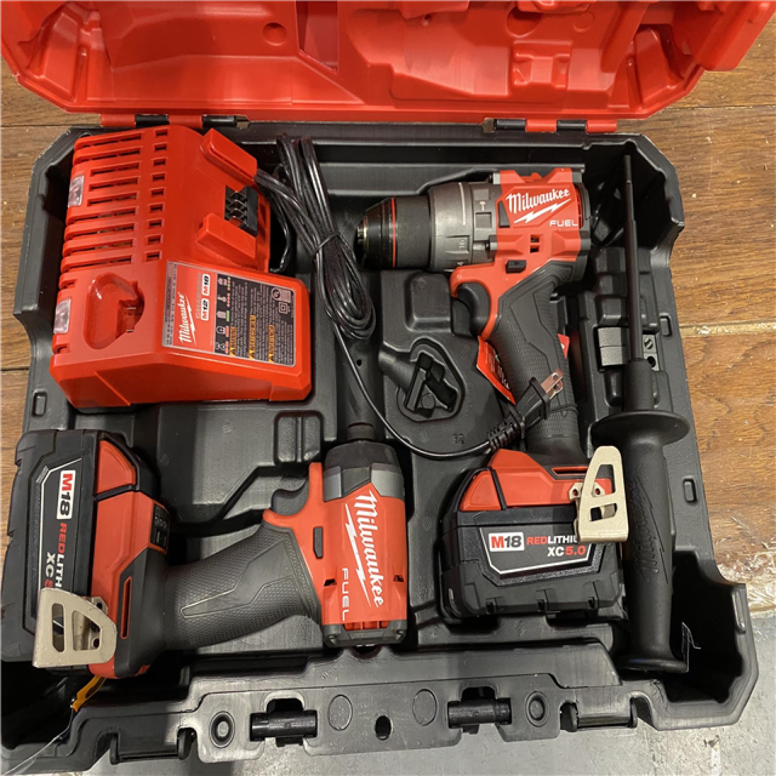 AS-IS MILWAUKEE M18 FUEL 18V Lithium-Ion Brushless Cordless Hammer Drill and Impact Driver Combo Kit (2-Tool) with 2 Batteries