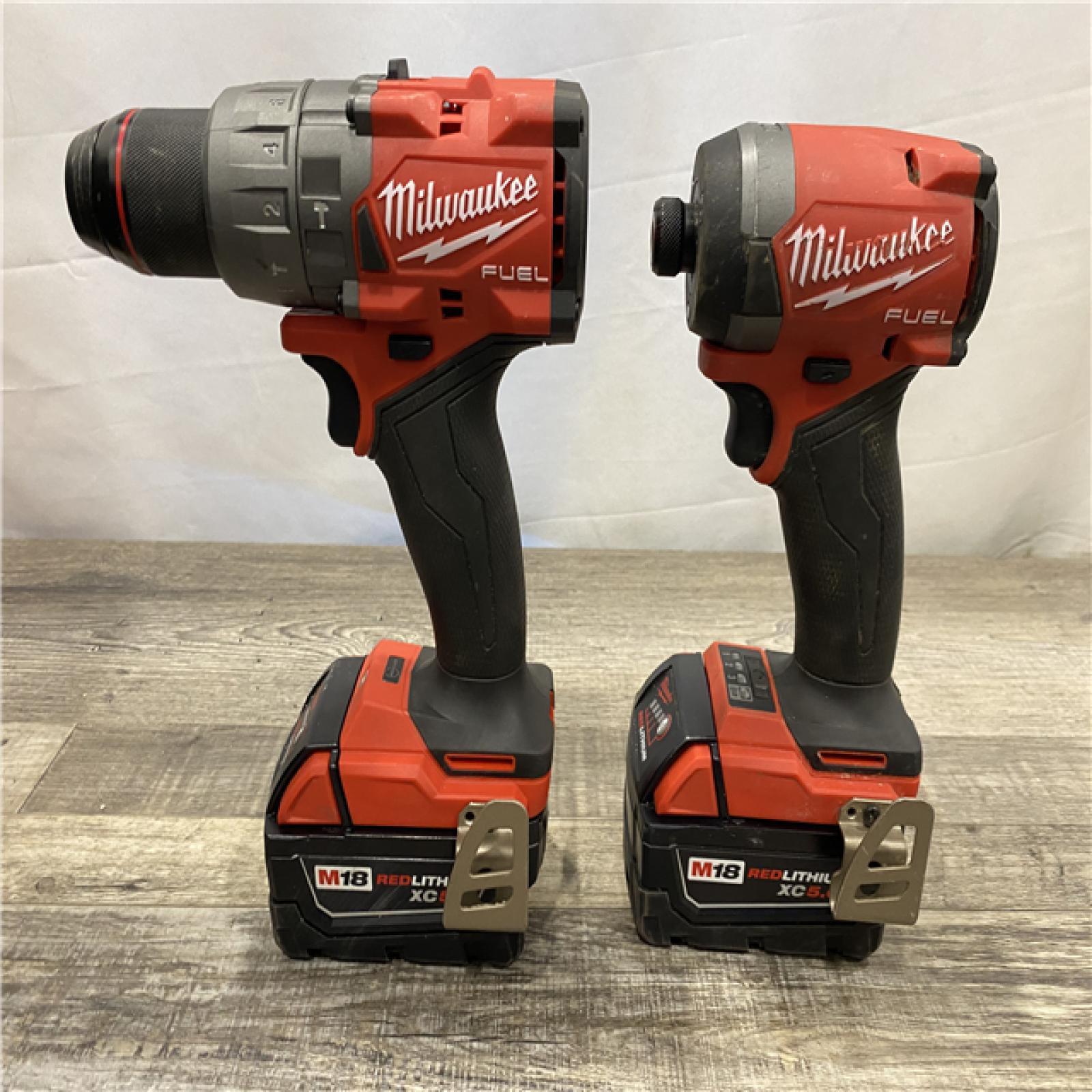 AS-IS Milwaukee FUEL 18V Lithium-Ion Brushless Cordless Hammer Drill and Impact Driver Combo Kit