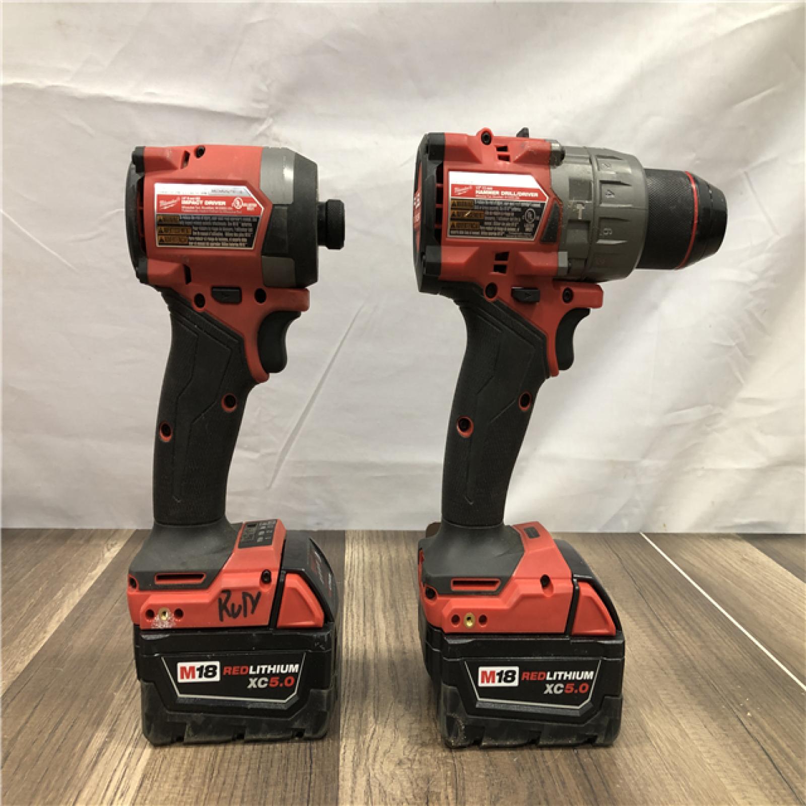 AS-IS Milwaukee FUEL 18V Lithium-Ion Brushless Cordless Hammer Drill and Impact Driver Combo Kit