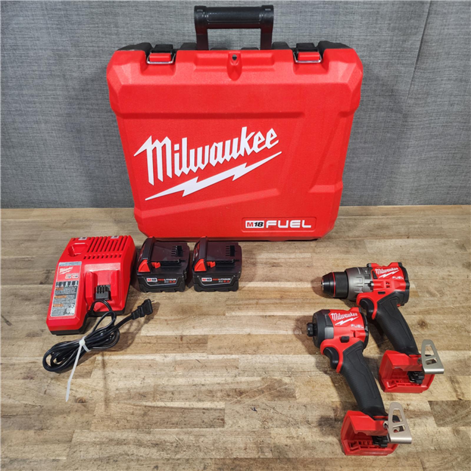 HOUSTON LOCATION - AS-IS Milwaukee FUEL 18V Lithium-Ion Brushless Cordless Hammer Drill and Impact Driver Combo Kit
