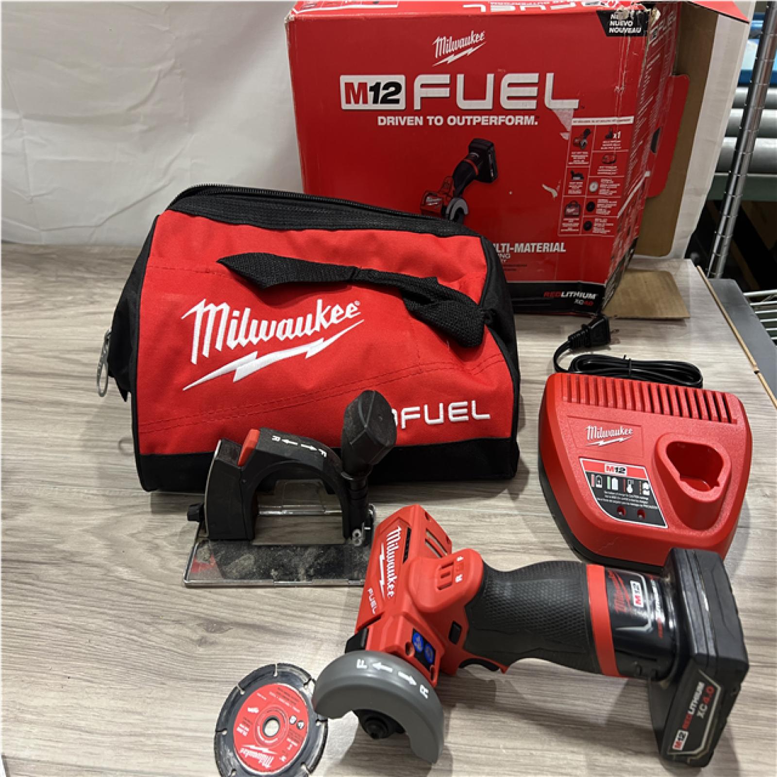 AS-IS MILWAUKEE M12 FUEL 12V 3 in. Lithium-Ion Brushless Cordless Cut Off Saw Kit with One 4.0 Ah Battery Charger and Bag