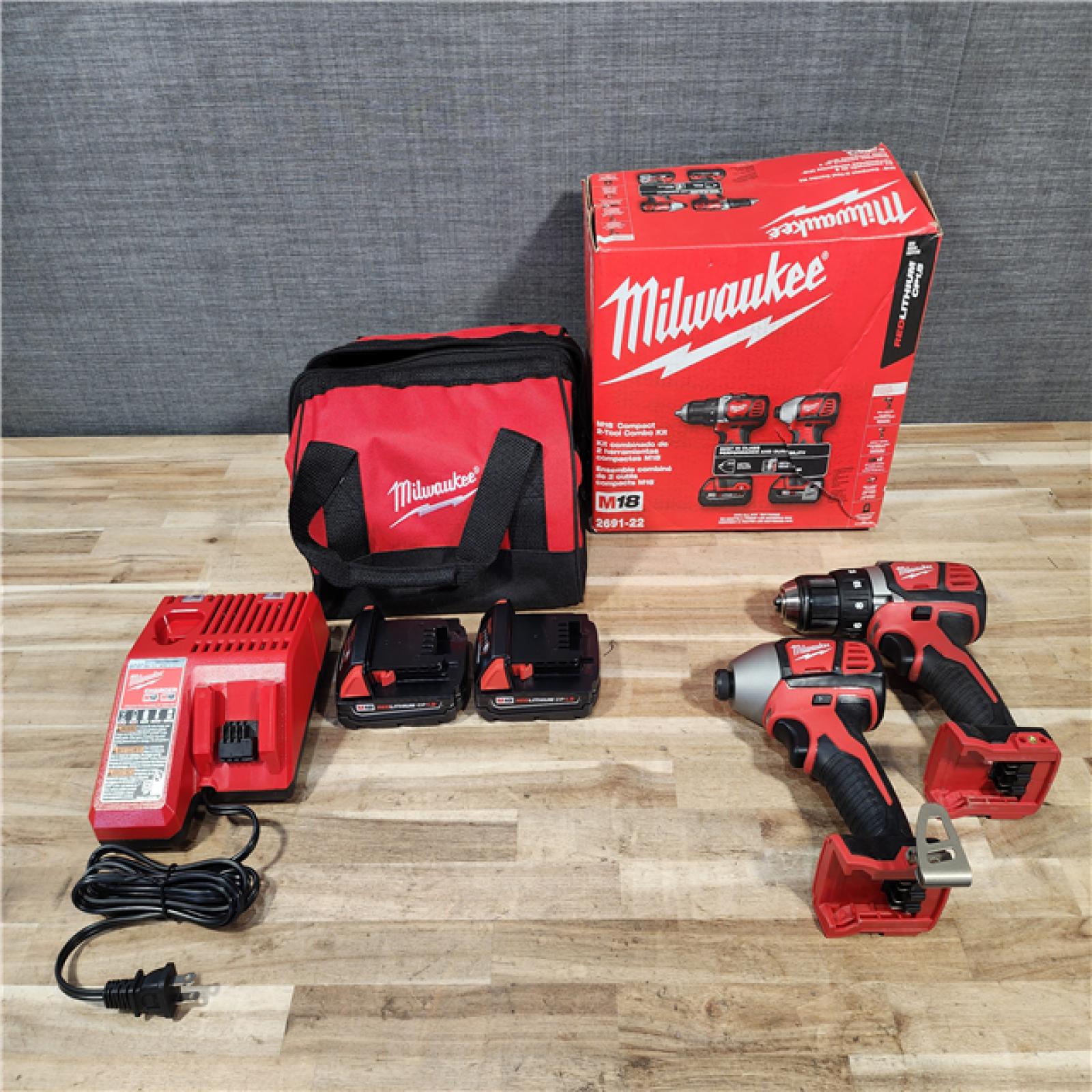 HOUSTON LOCATION - AS-IS Milwaukee 18V Lithium-Ion Cordless Drill Driver/Impact Driver Combo Kit