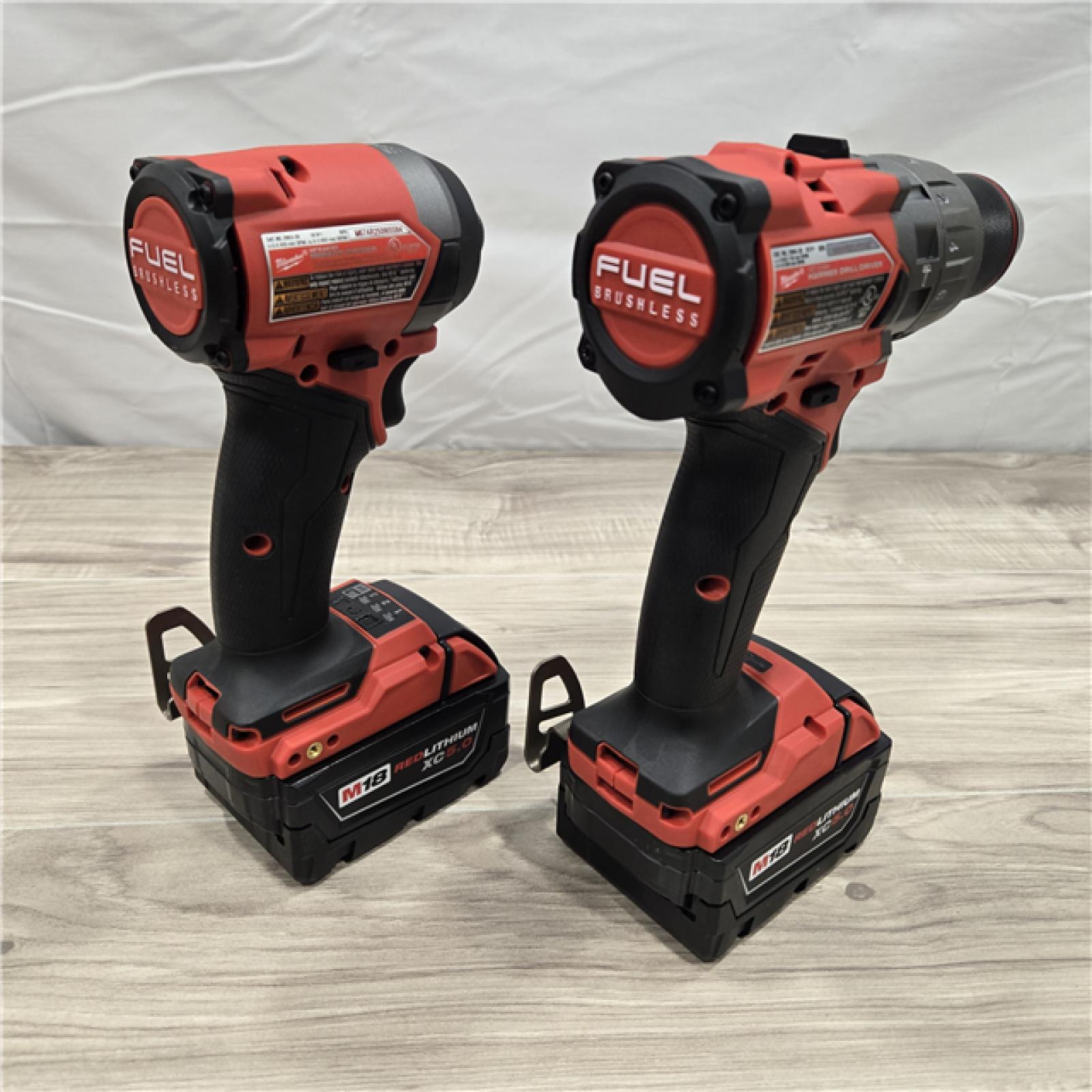 AS-IS MILWAUKEE FUEL 18V Lithium-Ion Brushless Cordless Hammer Drill and Impact Driver Combo Kit (2-Tool) with 2 Batteries