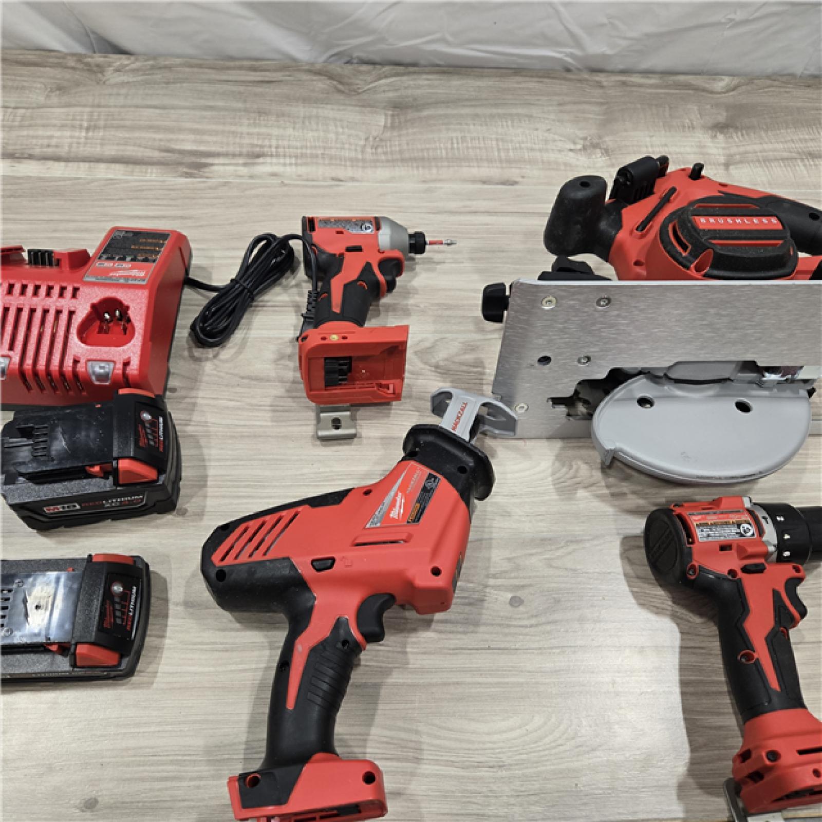 AS-IS Milwaukee M18 18-Volt Lithium-Ion Brushless Cordless Combo Kit (4-Tool) with 2-Batteries, 1-Charger and Tool Bag