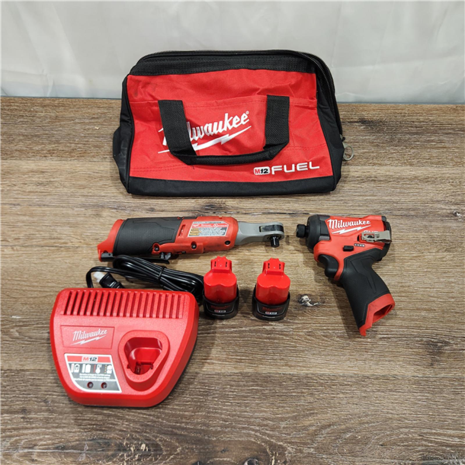 AS-IS Milwaukee M12 FUEL Brushless Cordless 1/4inch Hex Impact Driver with 3/8inch Ratchet Kit