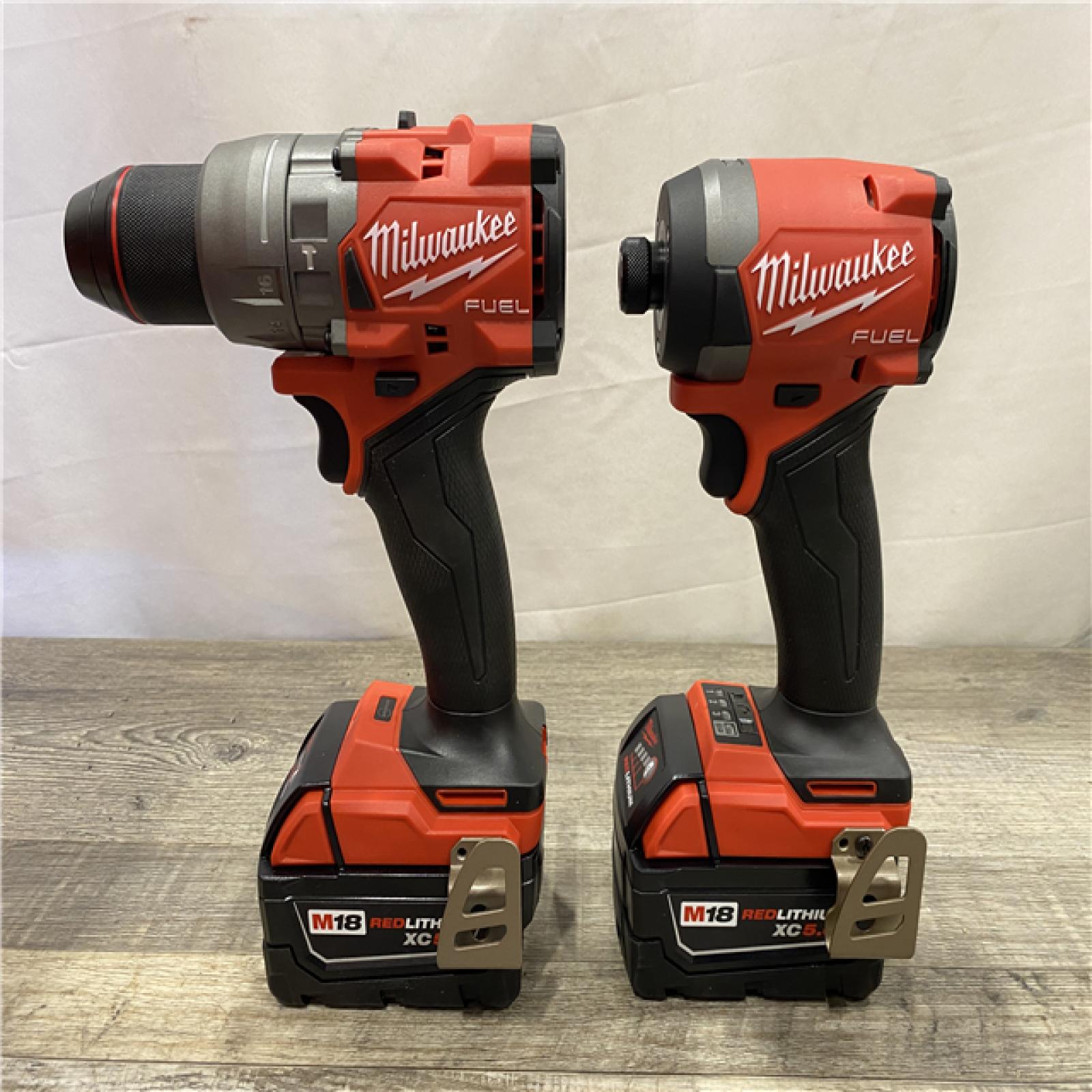 AS-IS Milwaukee FUEL 18V Lithium-Ion Brushless Cordless Hammer Drill and Impact Driver Combo Kit