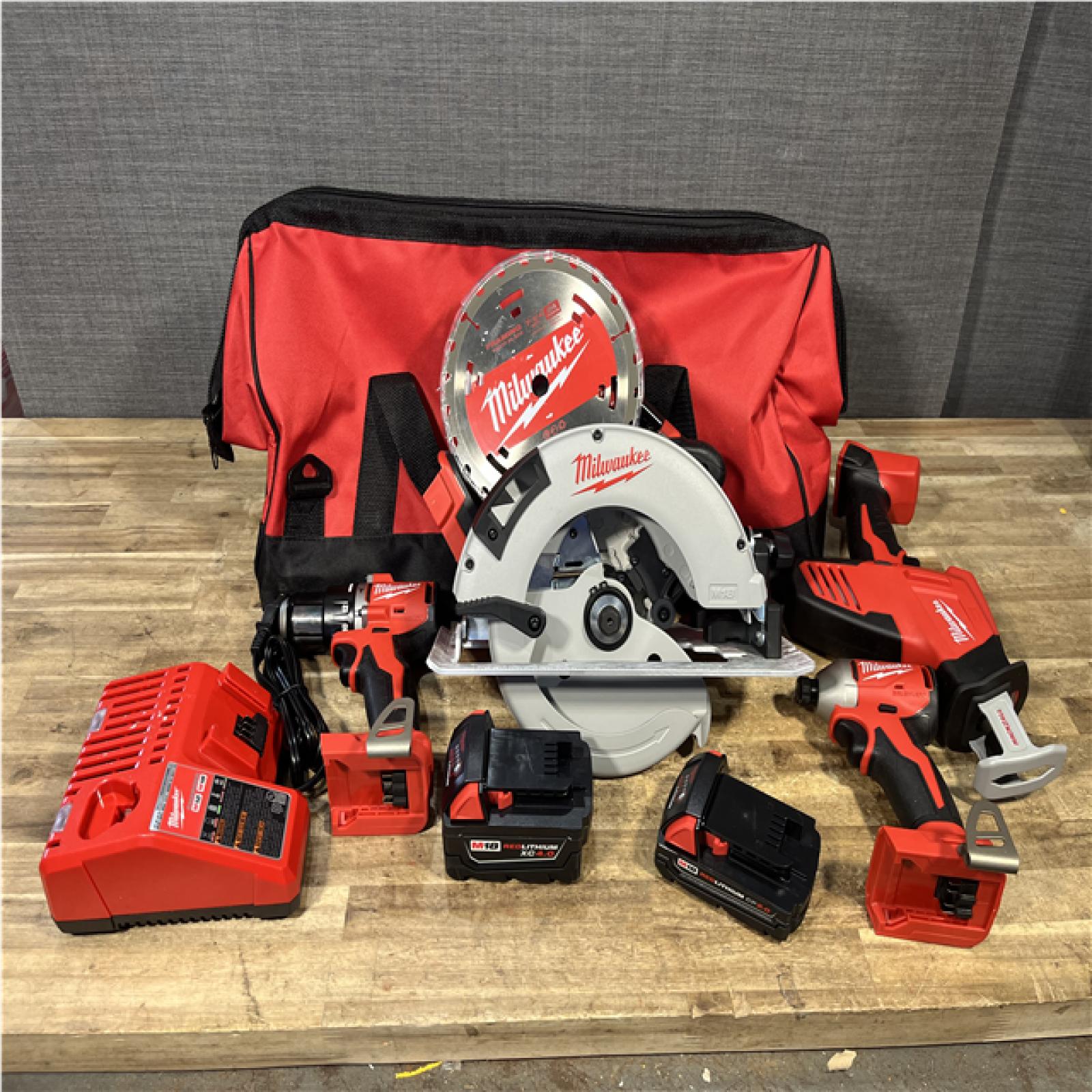 Houston Location AS-IS Milwaukee Hammer Drill Driver and Impact Driver Hackzall and Circular Saw and Batteries QTY/2 with Charger