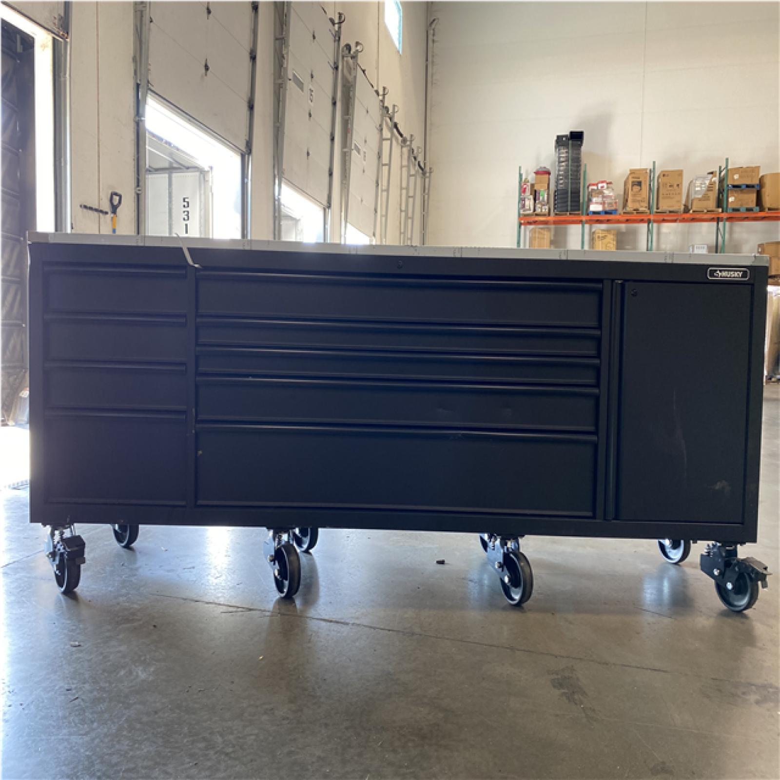 DALLAS LOCATION - AS-IS HUSKY 108 in. W x 24 in. D 9-Drawer Heavy-Duty Mobile Workbench with Stainless Steel Top/Matte Black