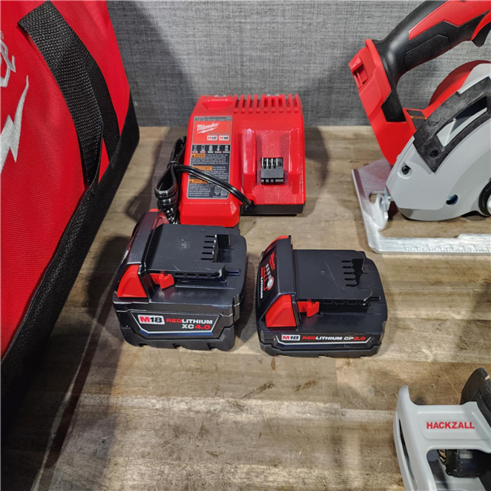 HOUSTON LOCATION - AS-IS Milwaukee M18 18-Volt Lithium-Ion Brushless Cordless Combo Kit (4-Tool) with 2-Batteries  1-Charger and Tool Bag