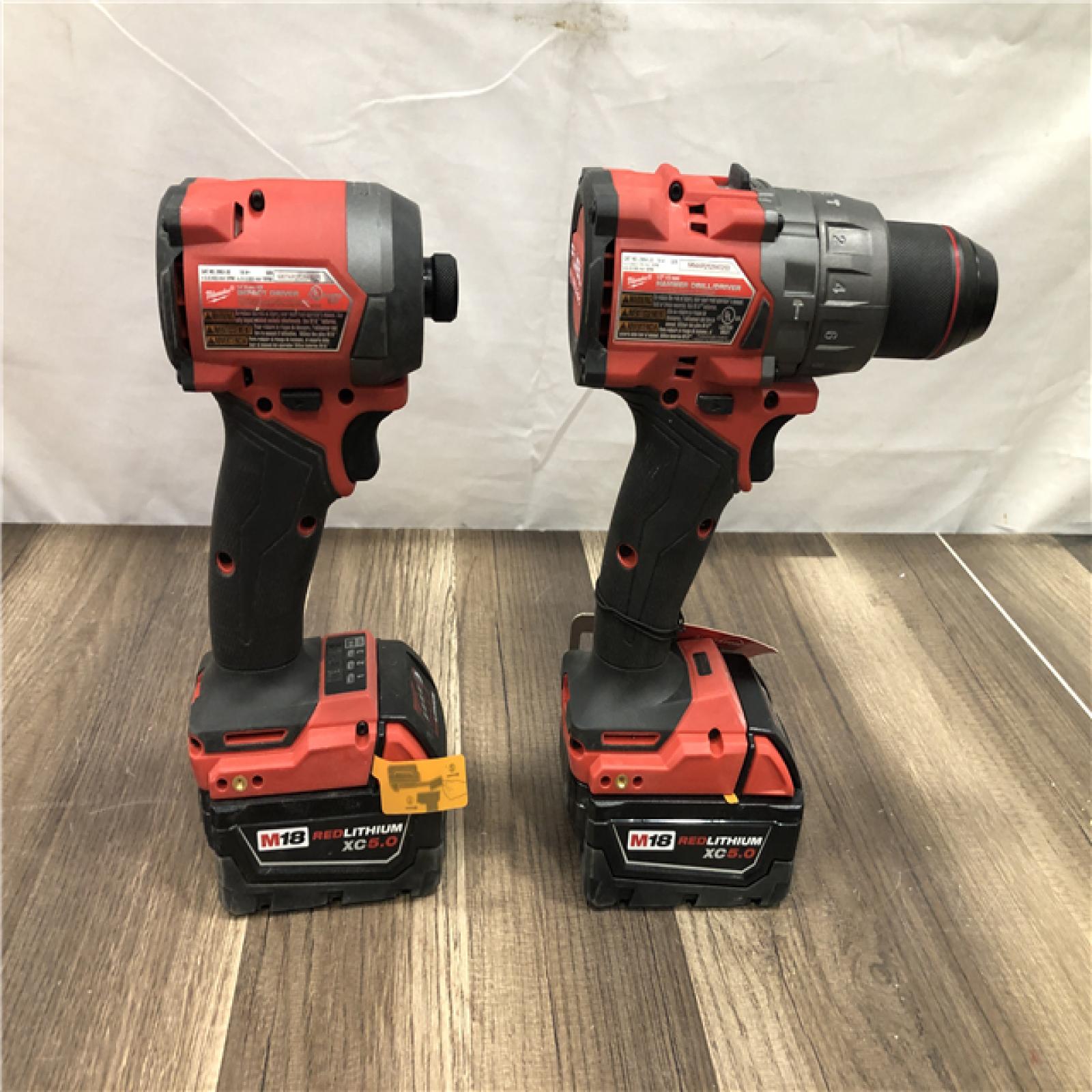 AS-IS Milwaukee  FUEL 18V Lithium-Ion Brushless Cordless Hammer Drill and Impact Driver Combo Kit