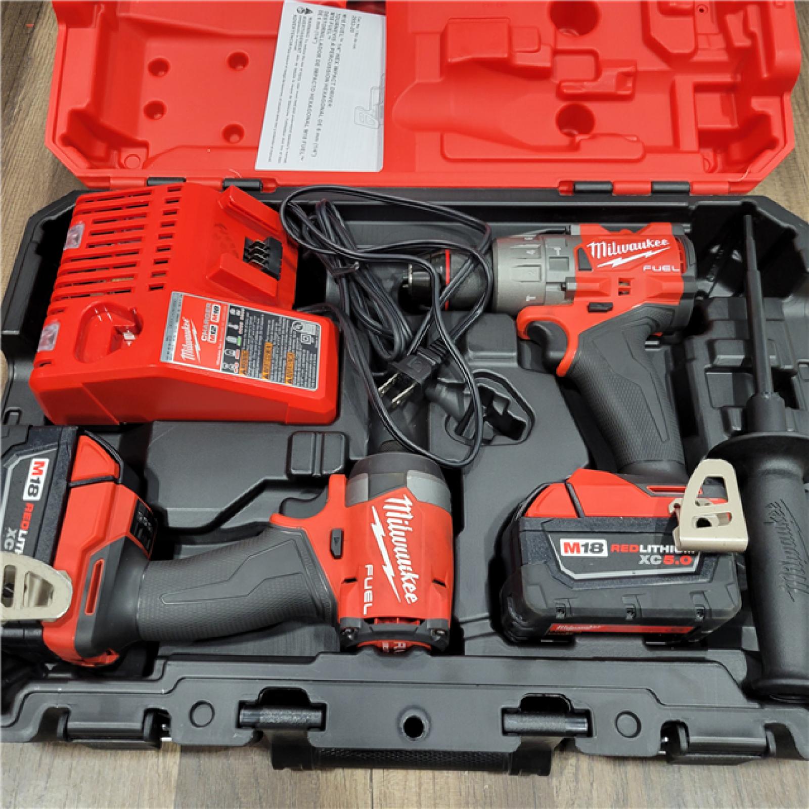 AS-IS MILWAUKEE M18 FUEL 18V Lithium-Ion Brushless Cordless Hammer Drill and Impact Driver Combo Kit (2-Tool) with 2 Batteries