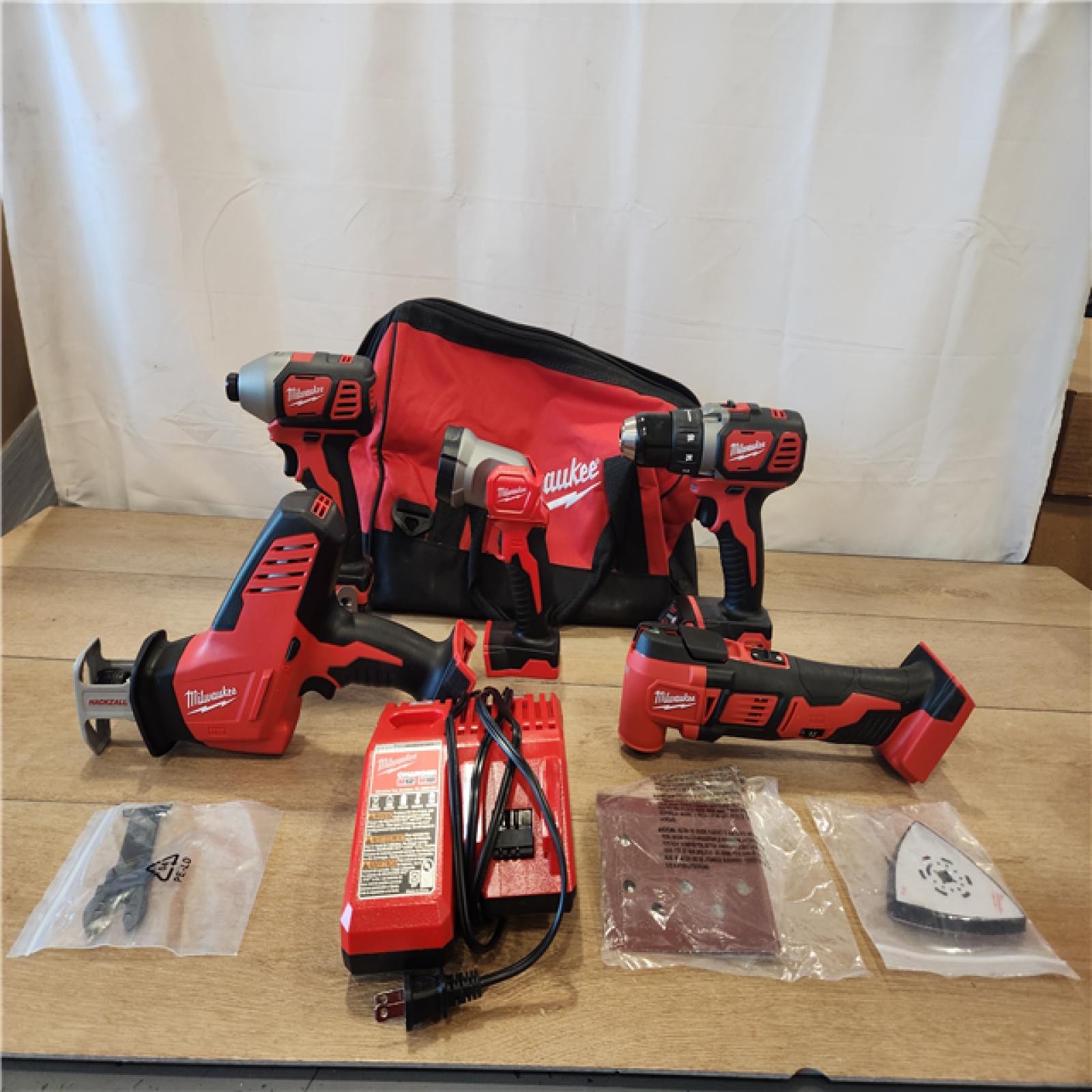 AS-IS- M18 18V Lithium-Ion Cordless Combo Kit (5-Tool) with (2) Batteries, Charger and Tool Bag