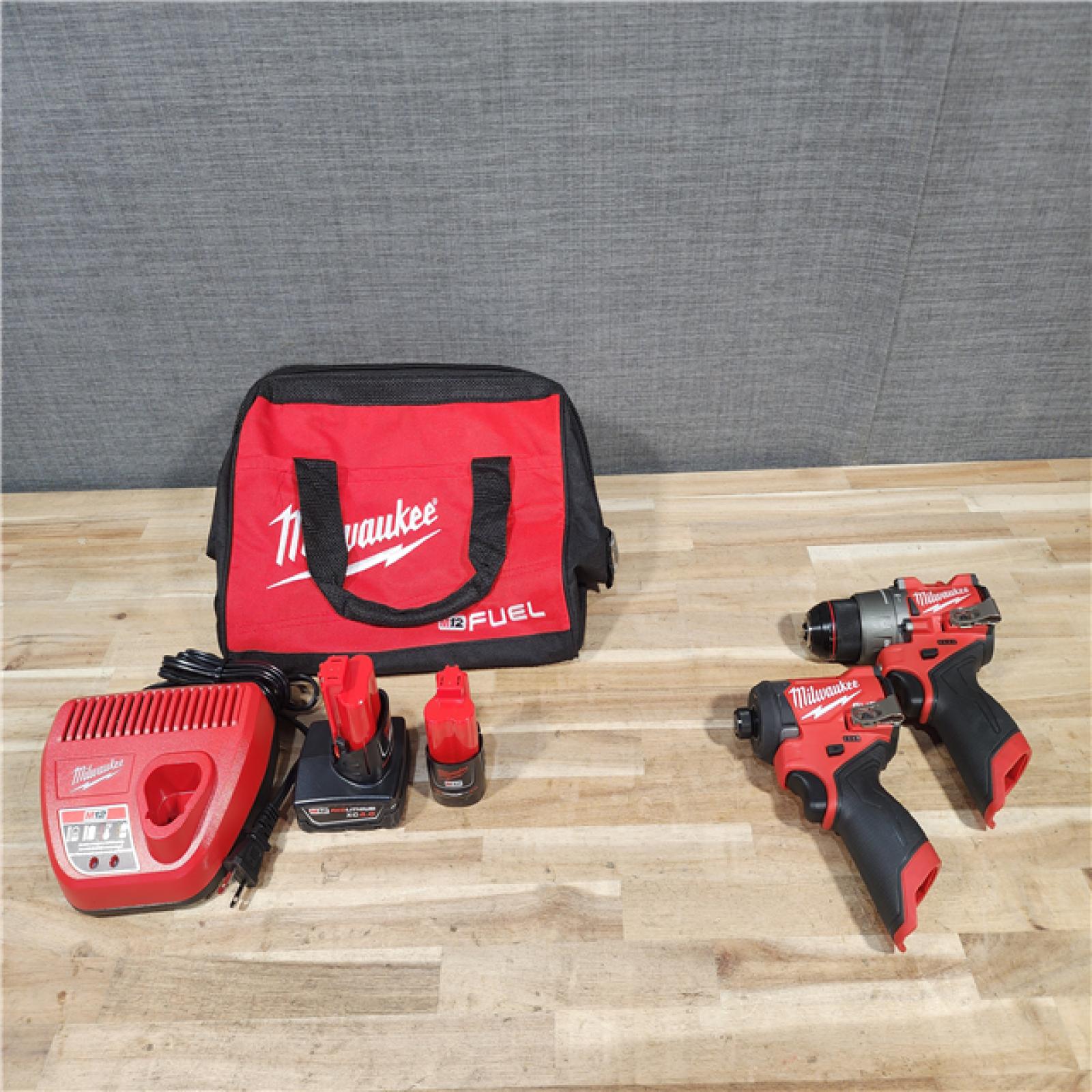 HOUSTON LOCATION - AS-IS Milwaukee FUEL 12-Volt Lithium-Ion Brushless Cordless Hammer Drill and Impact Driver Combo Kit