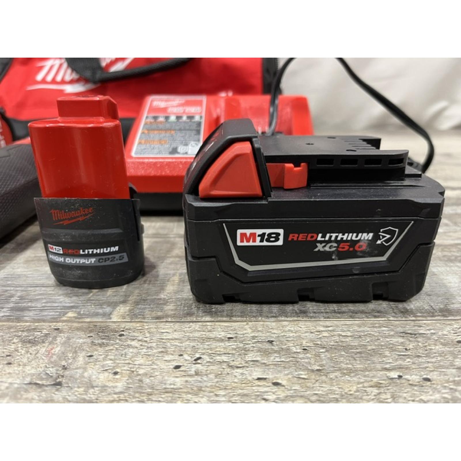 AS-IS Milwaukee FUEL 18V Cordless Mid Torque 1/2 in. Impact Wrench w/ 12 FUEL 3/8 in. Ratchet Combo Kit