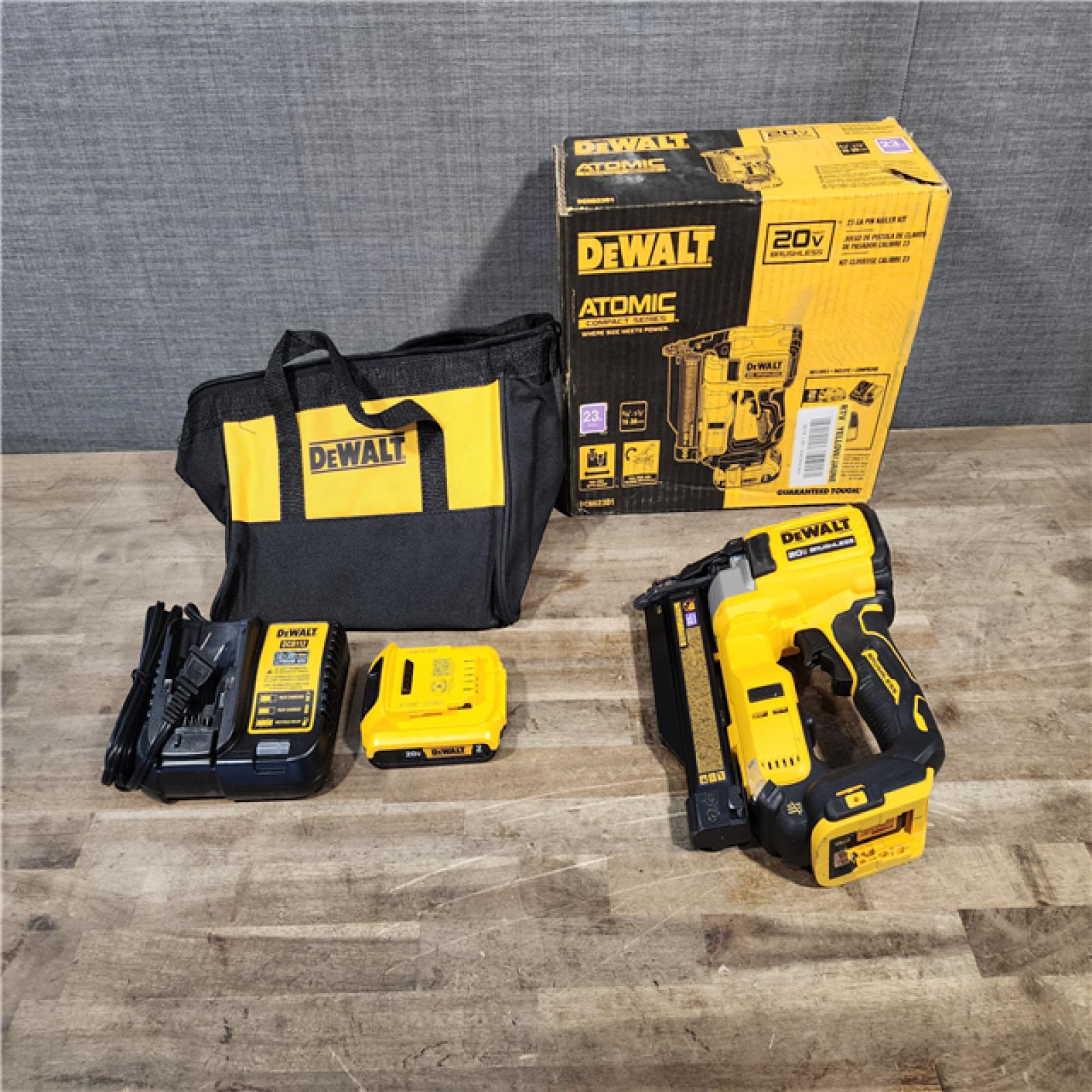 HOUSTON LOCATION - AS-IS DEWALT ATOMIC 20V MAX Lithium Ion Cordless 23 Gauge Pin Nailer Kit with 2.0Ah Battery and Charger