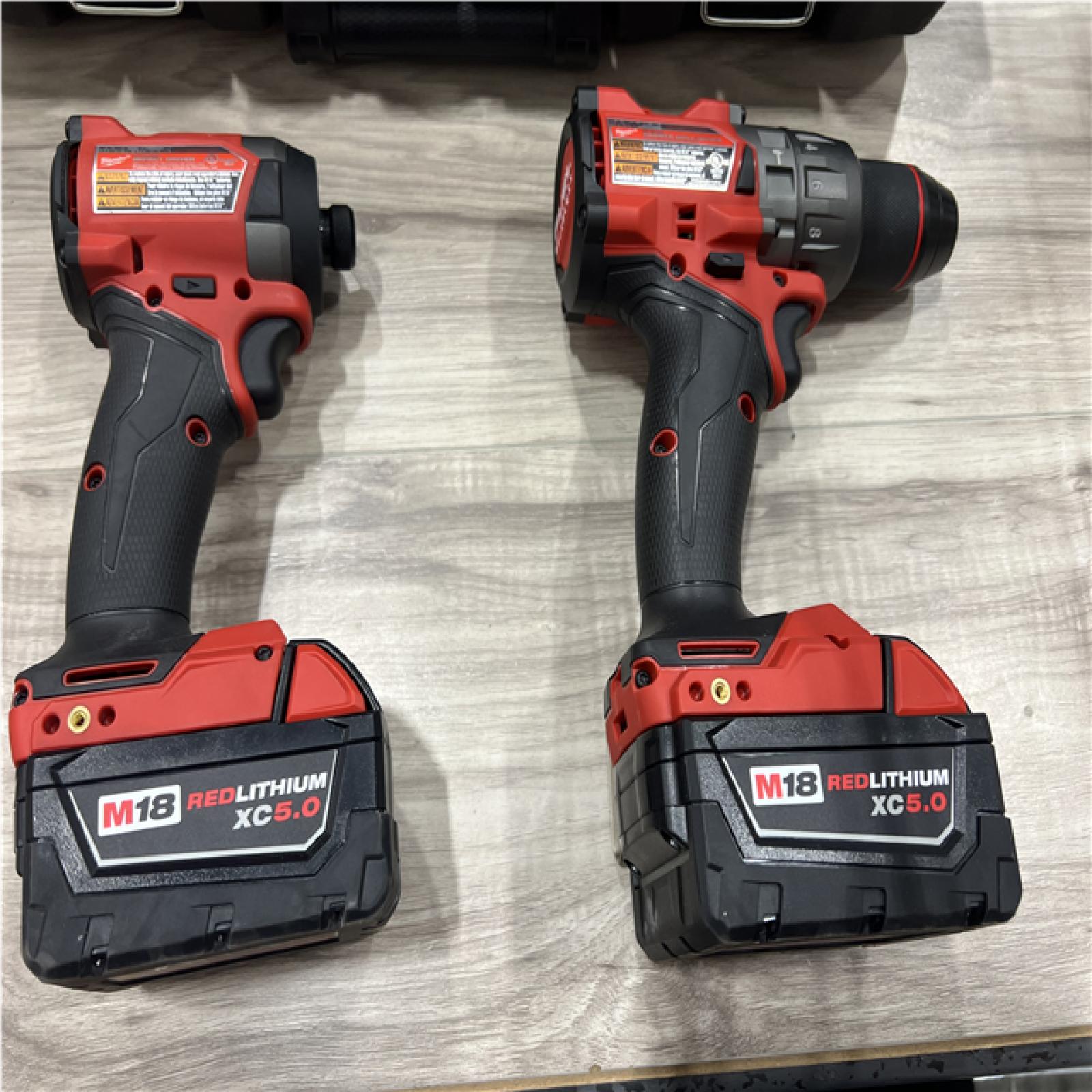 AS-IS Milwaukee FUEL 18V Lithium-Ion Brushless Cordless Hammer Drill and Impact Driver Combo Kit