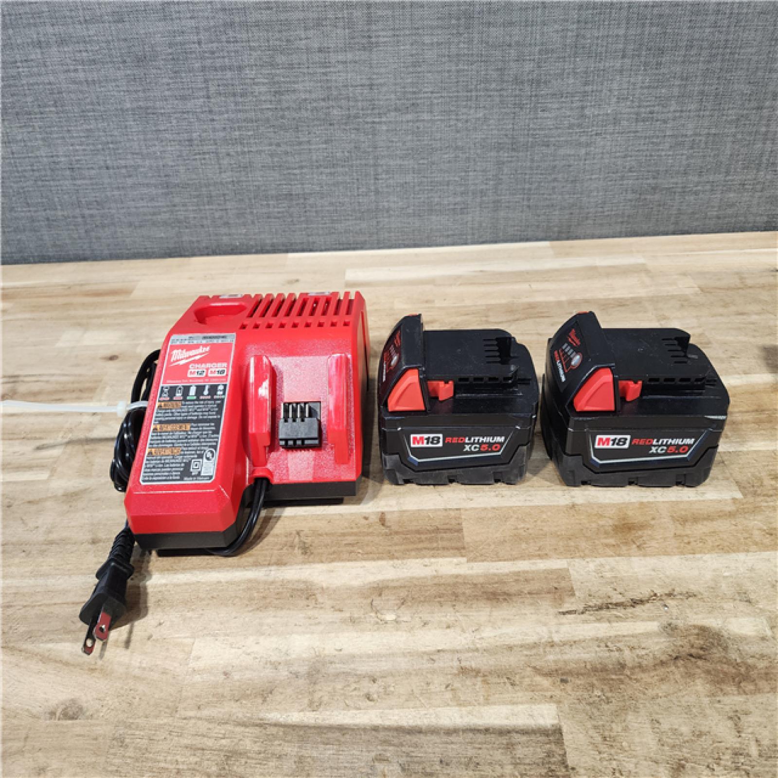 HOUSTON LOCATION - AS-IS MILWAUKEE 2 TOOL COMBO KIT W/ (2) BATTERY & CHARGER