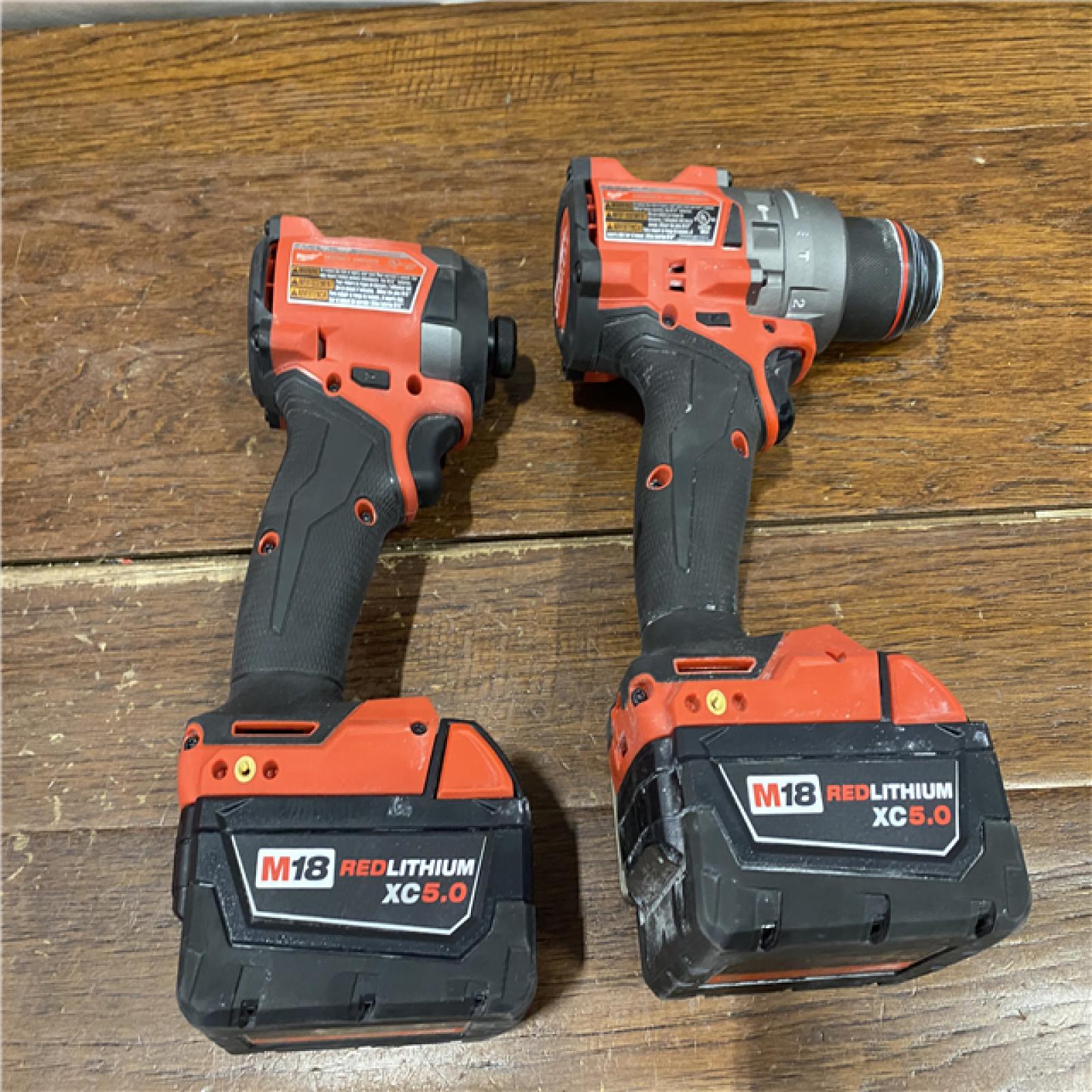 AS-IS MILWAUKEE M18 FUEL 18V Lithium-Ion Brushless Cordless Hammer Drill and Impact Driver Combo Kit (2-Tool) with 2 Batteries
