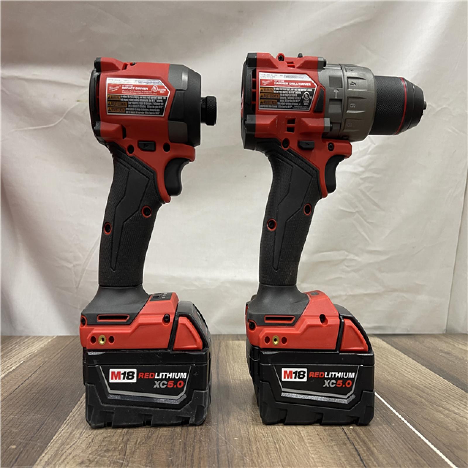 AS-IS Milwaukee  FUEL 18V Lithium-Ion Brushless Cordless Hammer Drill and Impact Driver Combo Kit