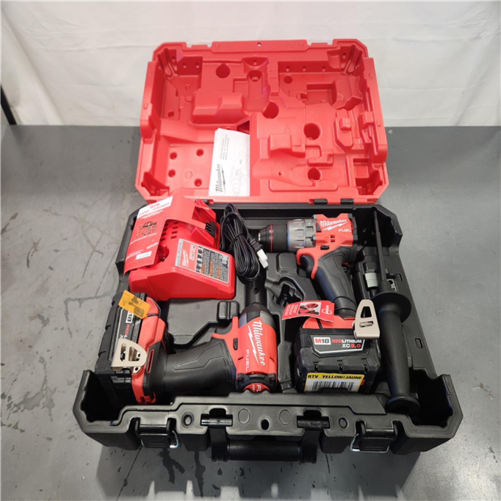 AS-IS- MILWAUKEE FUEL 18V Lithium-Ion Brushless Cordless Hammer Drill and Impact Driver Combo Kit