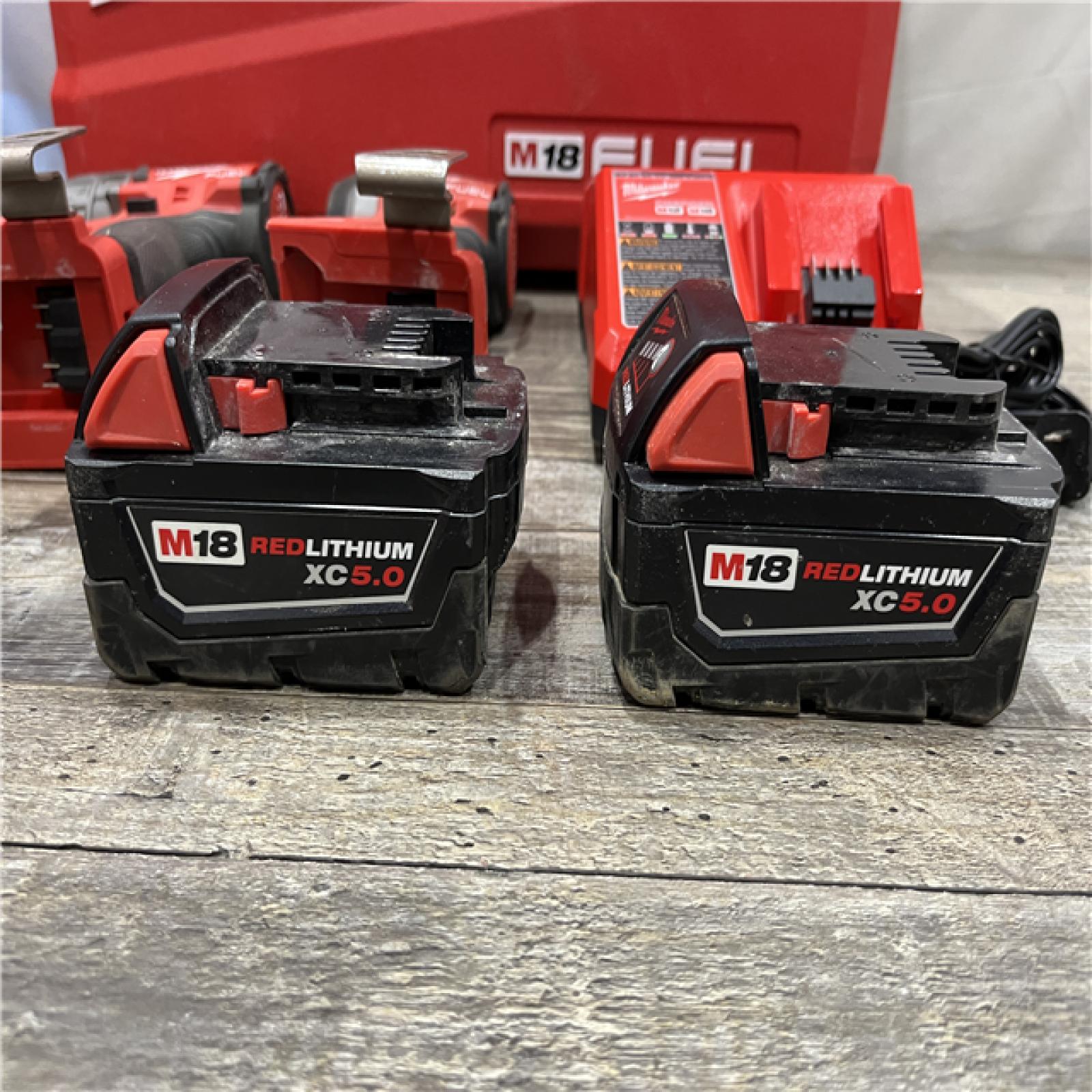 AS-IS Milwaukee FUEL 18V Lithium-Ion Brushless Cordless Hammer Drill and Impact Driver Combo Kit