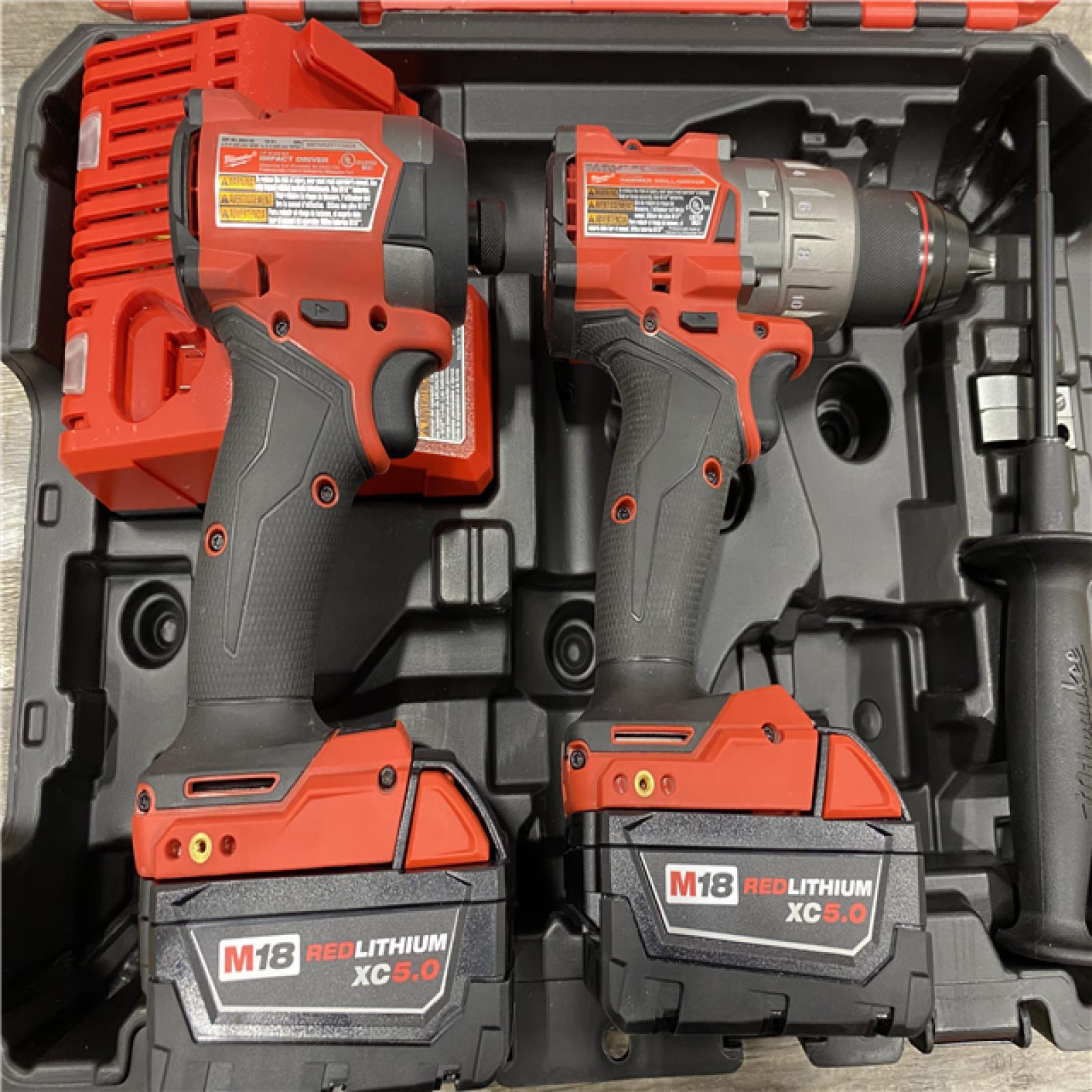 AS-IS Milwaukee FUEL 18V Lithium-Ion Brushless Cordless Hammer Drill and Impact Driver Combo Kit (2-Tool) with 2 Batteries