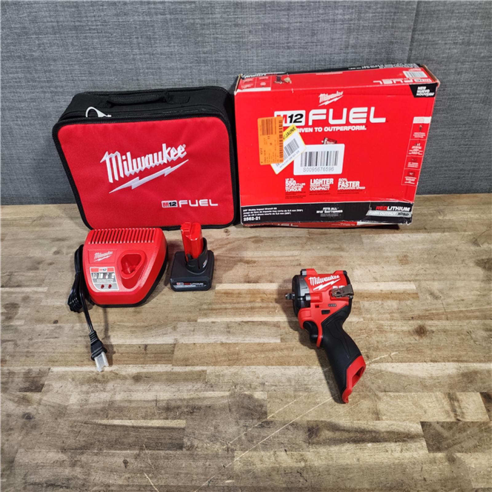 HOUSTON LOCATION - AS-IS (APPEARS LIKE NEW) Milwaukee M12 FUEL 12V Li-Ion Brushless Cordless Stubby 3/8 in. Impact Wrench Kit W/(1) 5.0 Ah High Output Battery
