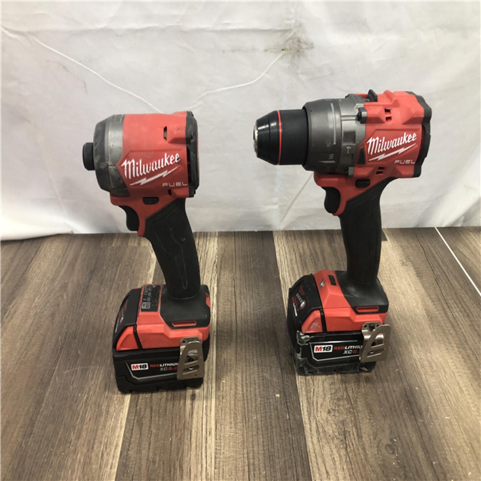 AS-IS Milwaukee FUEL 18V Lithium-Ion Brushless Cordless Hammer Drill and Impact Driver Combo Kit