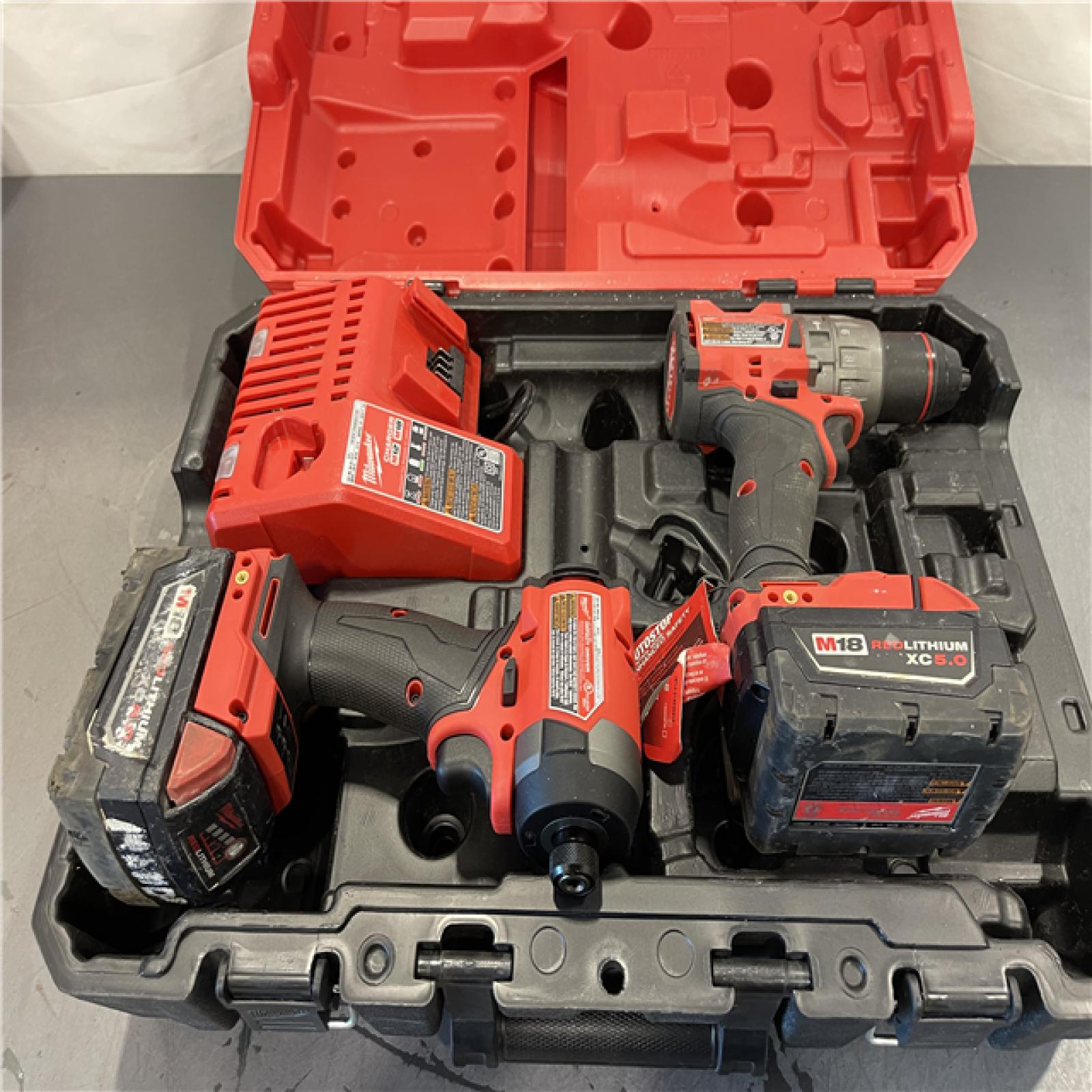 AS-IS - Milwaukee M18 FUEL 18V Lithium-Ion Brushless Cordless Hammer Drill and Impact Driver Combo Kit