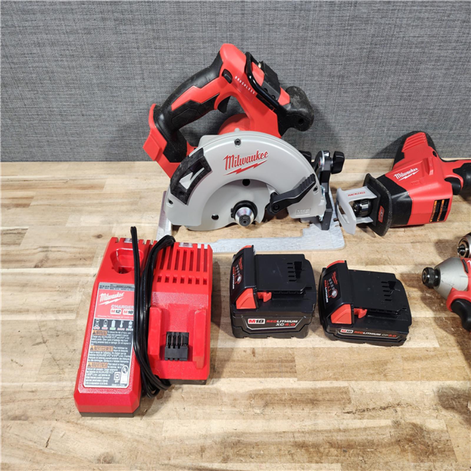 HOUSTON LOCATION - AS - IS Milwaukee 18-Volt Lithium-Ion Brushless Cordless (4-Tool) Combo Kit