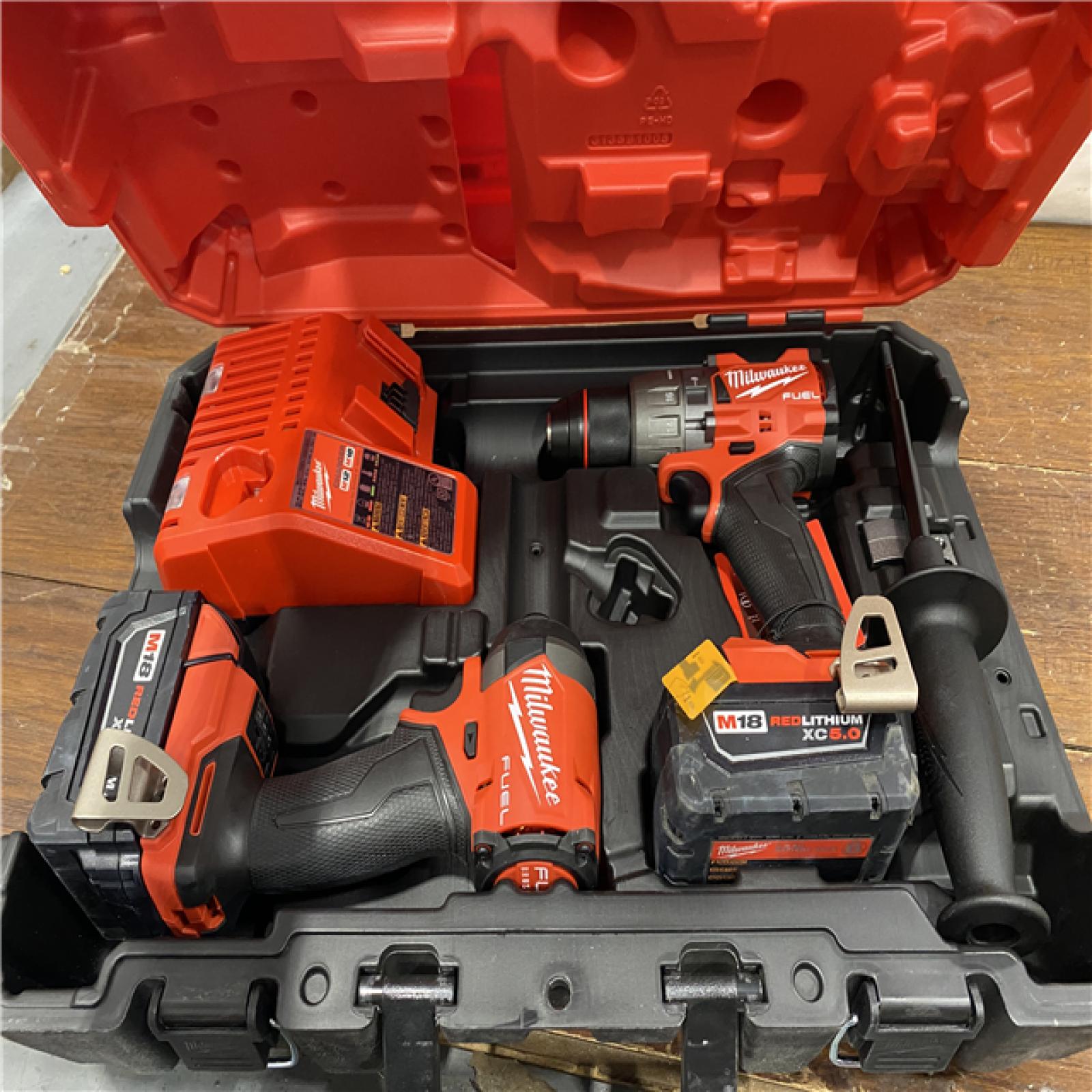 AS-IS MILWAUKEE M18 FUEL 18V Lithium-Ion Brushless Cordless Hammer Drill and Impact Driver Combo Kit (2-Tool) with 2 Batteries